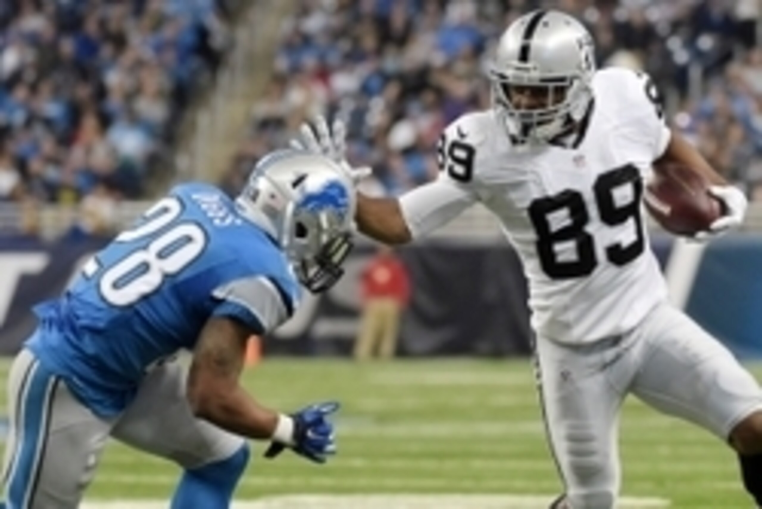 Nov 22, 2015; Detroit, MI, USA; Oakland Raiders wide receiver Amari Cooper (89) carries the ball as Detroit Lions cornerback Quandre Diggs (28) defends at Ford Field. The Lions won 18-13. Mandatory Credit: Kirby Lee-USA TODAY Sports