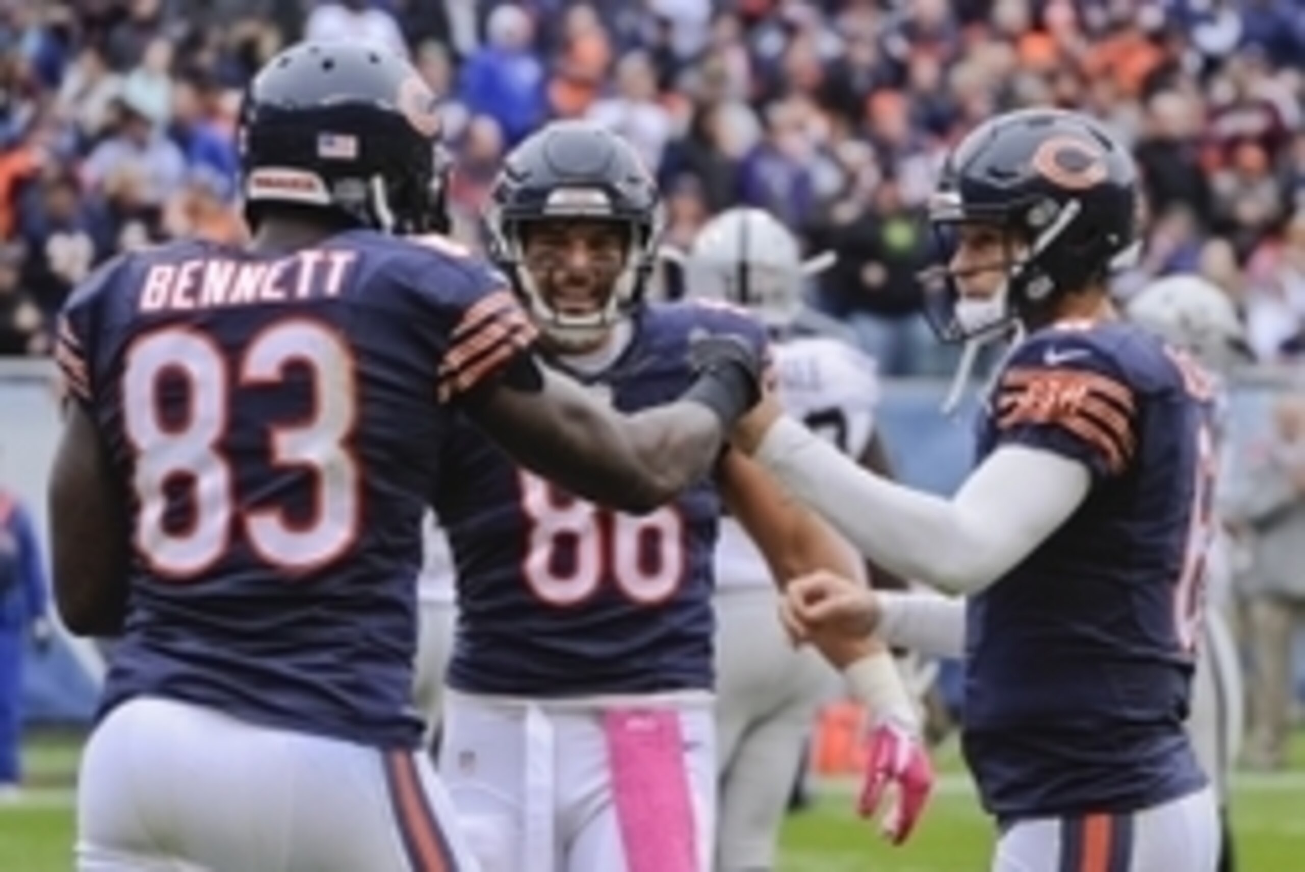 Oct 4, 2015; Chicago, IL, USA;Chicago Bears quarterback Jay Cutler (6) fist bumps Chicago Bears tight end Martellus Bennett (83) as Chicago Bears tight end Zach Miller (86) looks on after a touchdown against the Oakland Raiders at Soldier Field.  Mandator