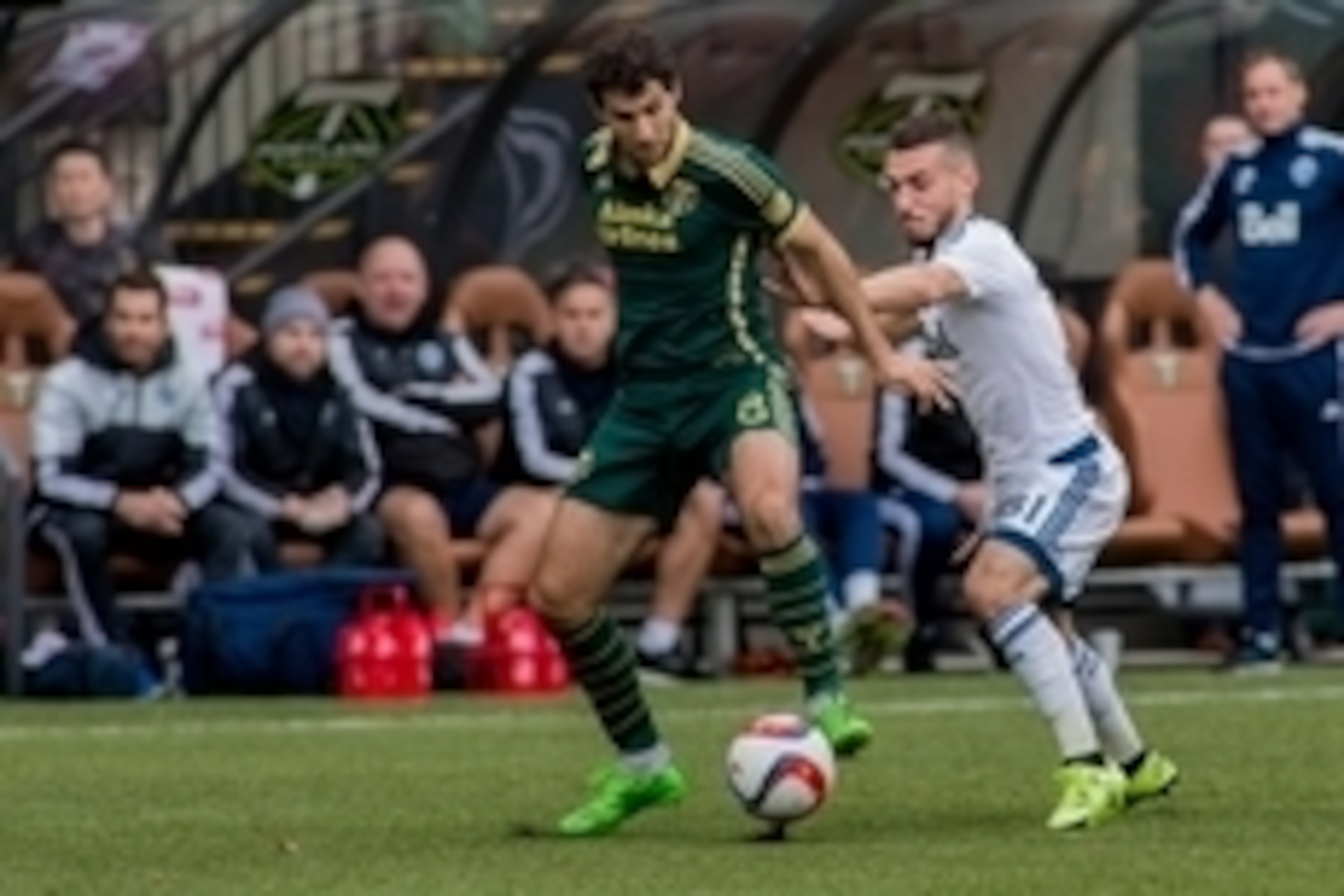 Nov 1, 2015; Portland, OR, USA; Vancouver Whitecaps FC midfielder Russell Teibert (31) attempts to tackle Portland Timbers midfielder Diego Valeri (8) at Providence Park. The Timbers and Whitecaps tied 0-0. Mandatory Credit: Bob Frid - USA TODAY Sports