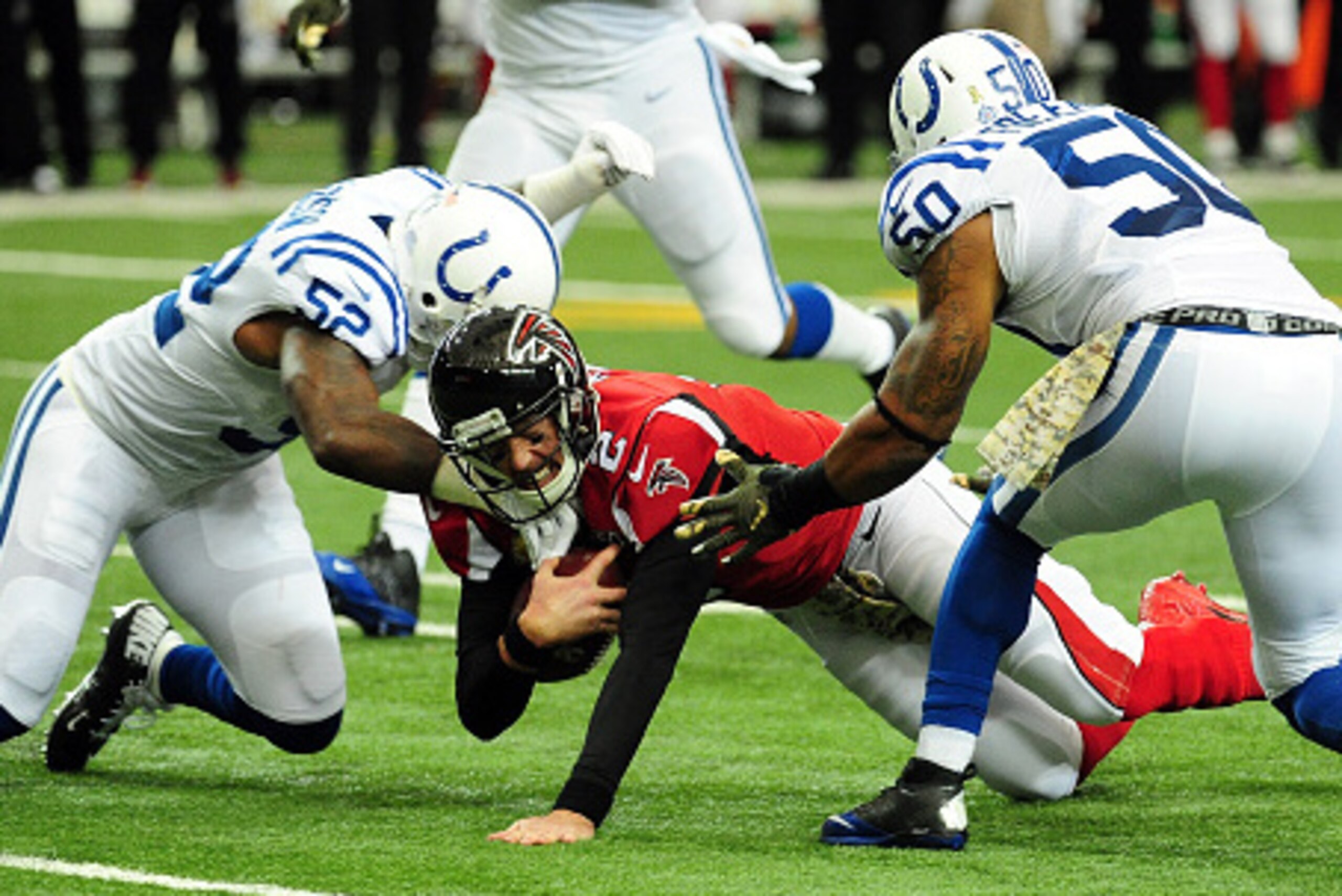 ATLANTA, GA - NOVEMBER 22: Matt Ryan #2 of the Atlanta Falcons is tackled by D'Qwell Jackson #52 and Jerrell Freeman #50 of the Indianapolis Colts during the first half at the Georgia Dome on November 22, 2015 in Atlanta, Georgia. (Photo by Scott Cunning ATLANTA, GA - NOVEMBER 22: Matt Ryan #2 of the Atlanta Falcons is tackled by D'Qwell Jackson #52 and Jerrell Freeman #50 of the Indianapolis Colts during the first half at the Georgia Dome on November 22, 2015 in Atlanta, Georgia. (Photo by Scott Cunning