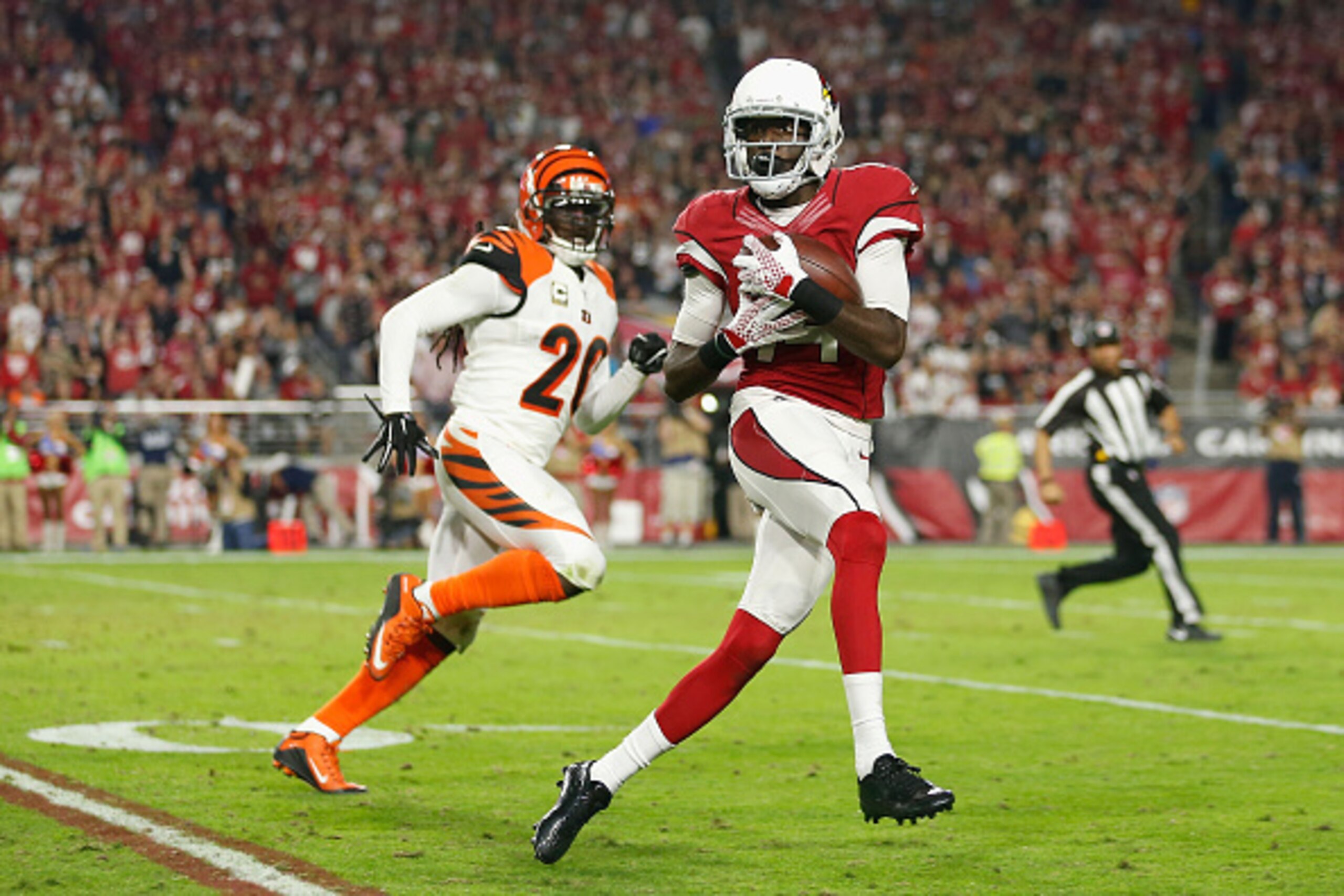GLENDALE, AZ - NOVEMBER 22: Wide receiver J.J. Nelson #14 of the Arizona Cardinals hauls in a 64-yard touchdown pass over free safety Reggie Nelson #20 of the Cincinnati Bengals during the thrid quarter of the NFL game at the University of Phoenix Stadium