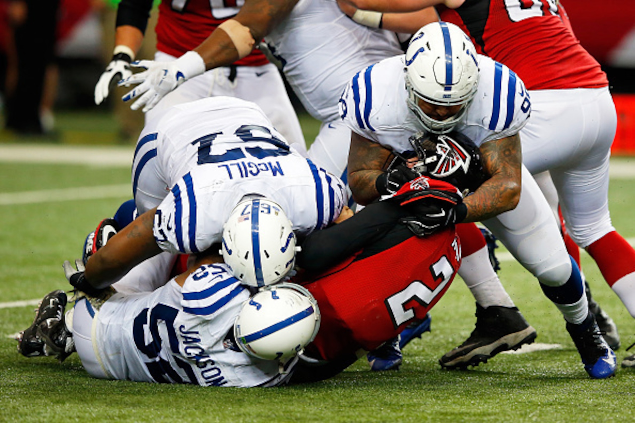 ATLANTA, GA - NOVEMBER 22:  Matt Ryan #2 of the Atlanta Falcons is sacked by T.Y. McGill #67, D'Qwell Jackson #52 and Billy Winn #99 of the Indianapolis Colts during the second half at the Georgia Dome on November 22, 2015 in Atlanta, Georgia.  (Photo by 