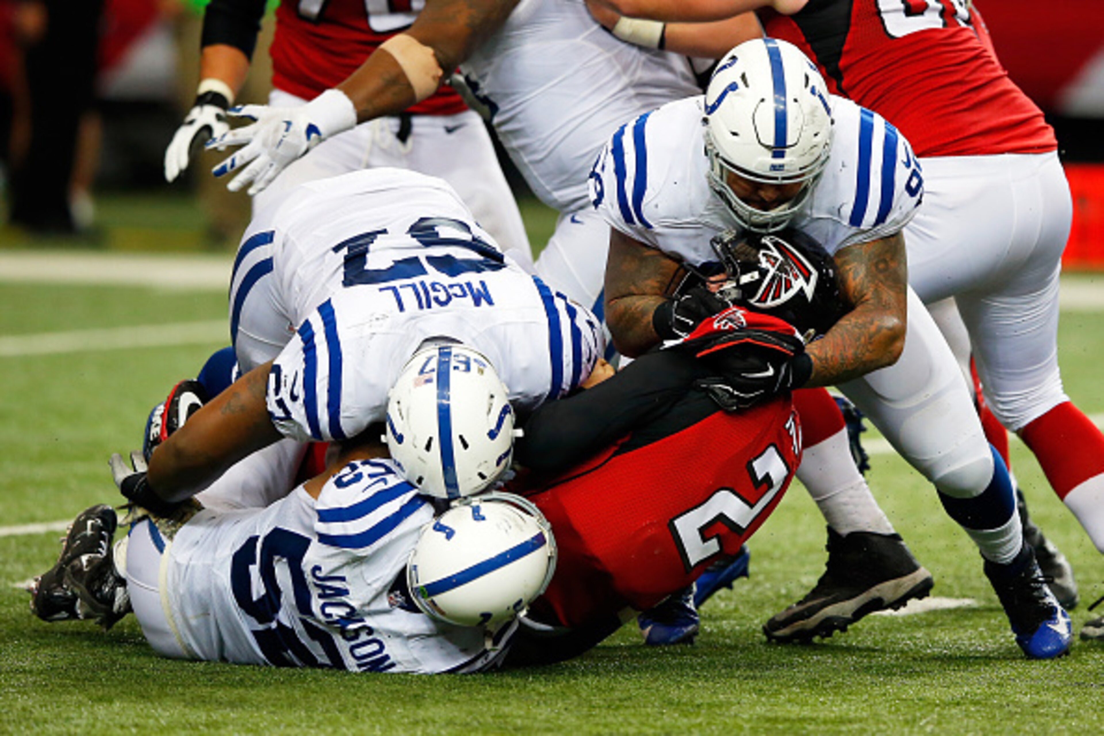 ATLANTA, GA - NOVEMBER 22:  Matt Ryan #2 of the Atlanta Falcons is sacked by T.Y. McGill #67, D'Qwell Jackson #52 and Billy Winn #99 of the Indianapolis Colts during the second half at the Georgia Dome on November 22, 2015 in Atlanta, Georgia.  (Photo by 