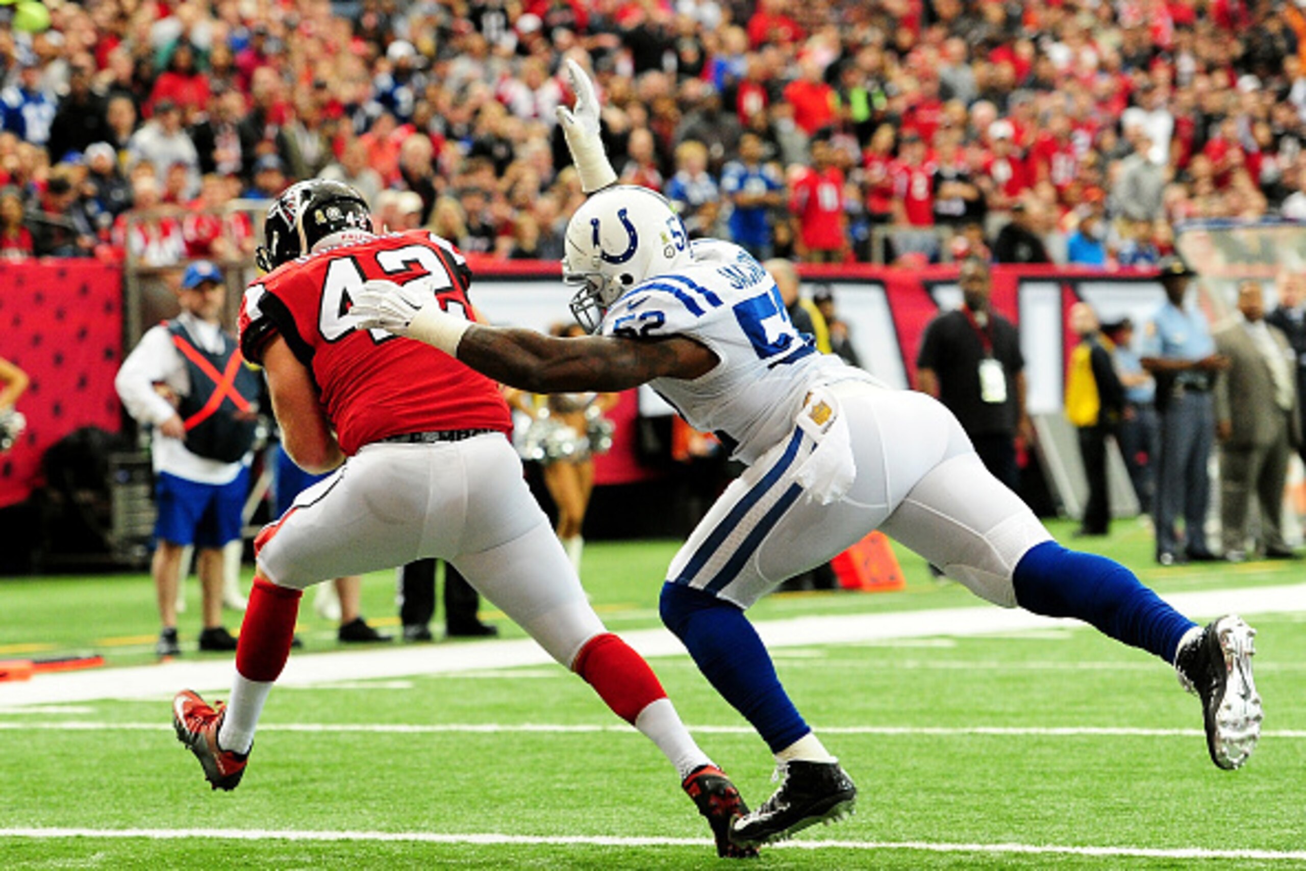 ATLANTA, GA - NOVEMBER 22: Patrick DiMarco #42 of the Atlanta Falcons catches a touchdown pass against D'Qwell Jackson #52 of the Indianapolis Colts during the first half at the Georgia Dome on November 22, 2015 in Atlanta, Georgia.  (Photo by Scott Cunni