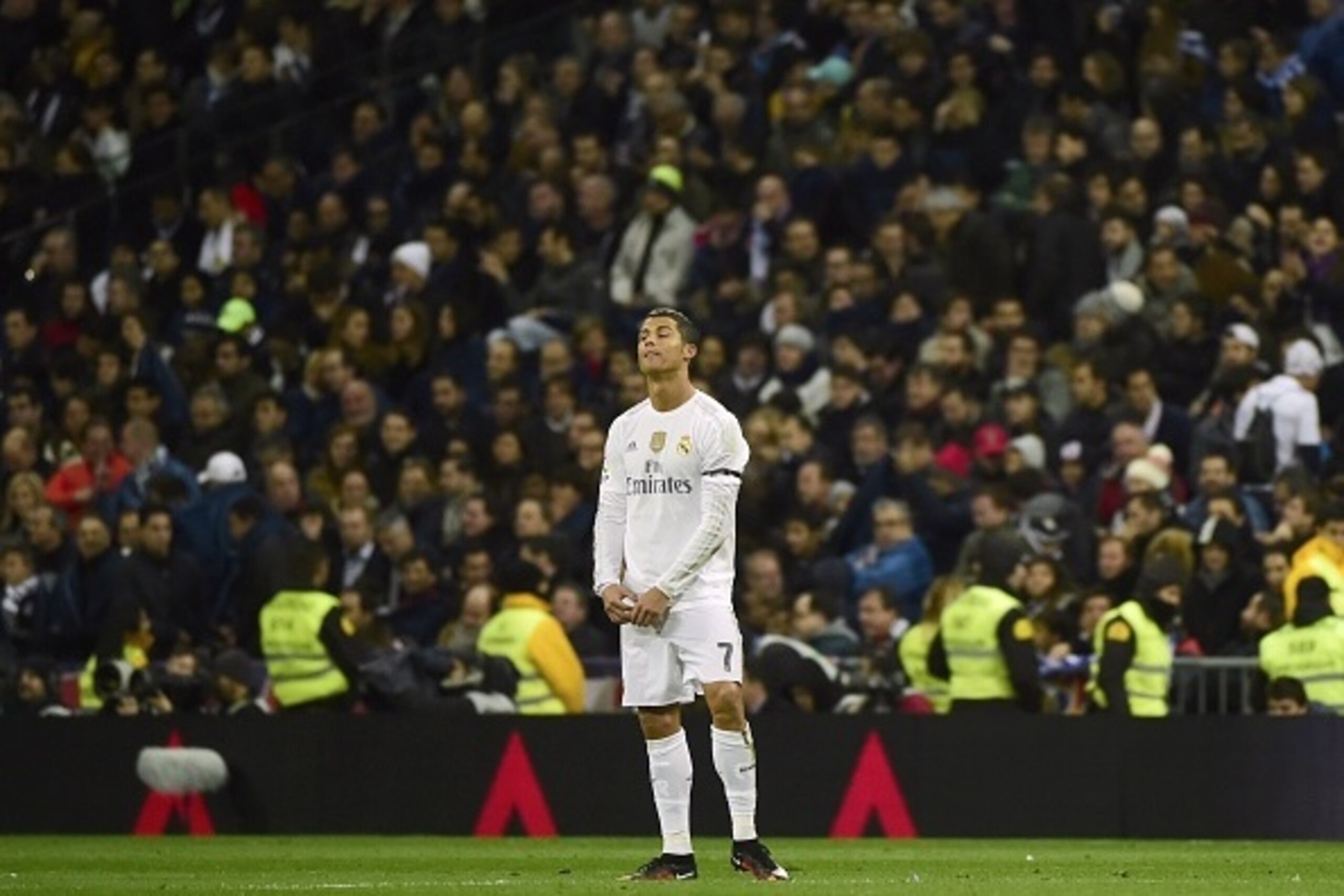 Real Madrid's Portuguese forward Cristiano Ronaldo stands during the Spanish league 'Clasico' football match Real Madrid CF vs FC Barcelona at the Santiago Bernabeu stadium in Madrid on November 21, 2014.   AFP PHOTO / PIERRE-PHILIPPE MARCOU        (Photo