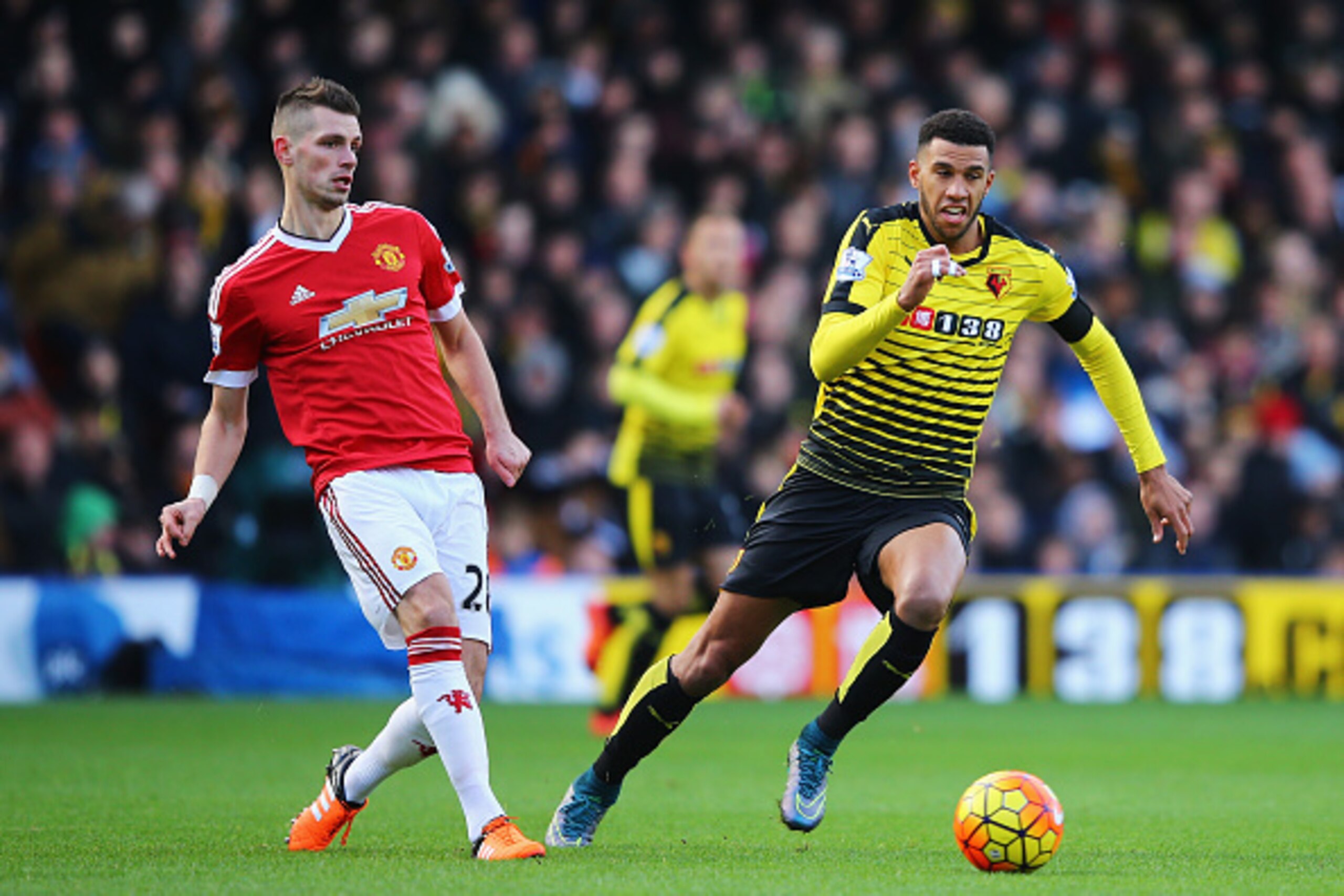 WATFORD, ENGLAND - NOVEMBER 21: Morgan Schneiderlin of Manchester United and Etienne Capoue of Watford compete for the ball during the Barclays Premier League match between Watford and Manchester United at Vicarage Road on November 21, 2015 in Watford, En