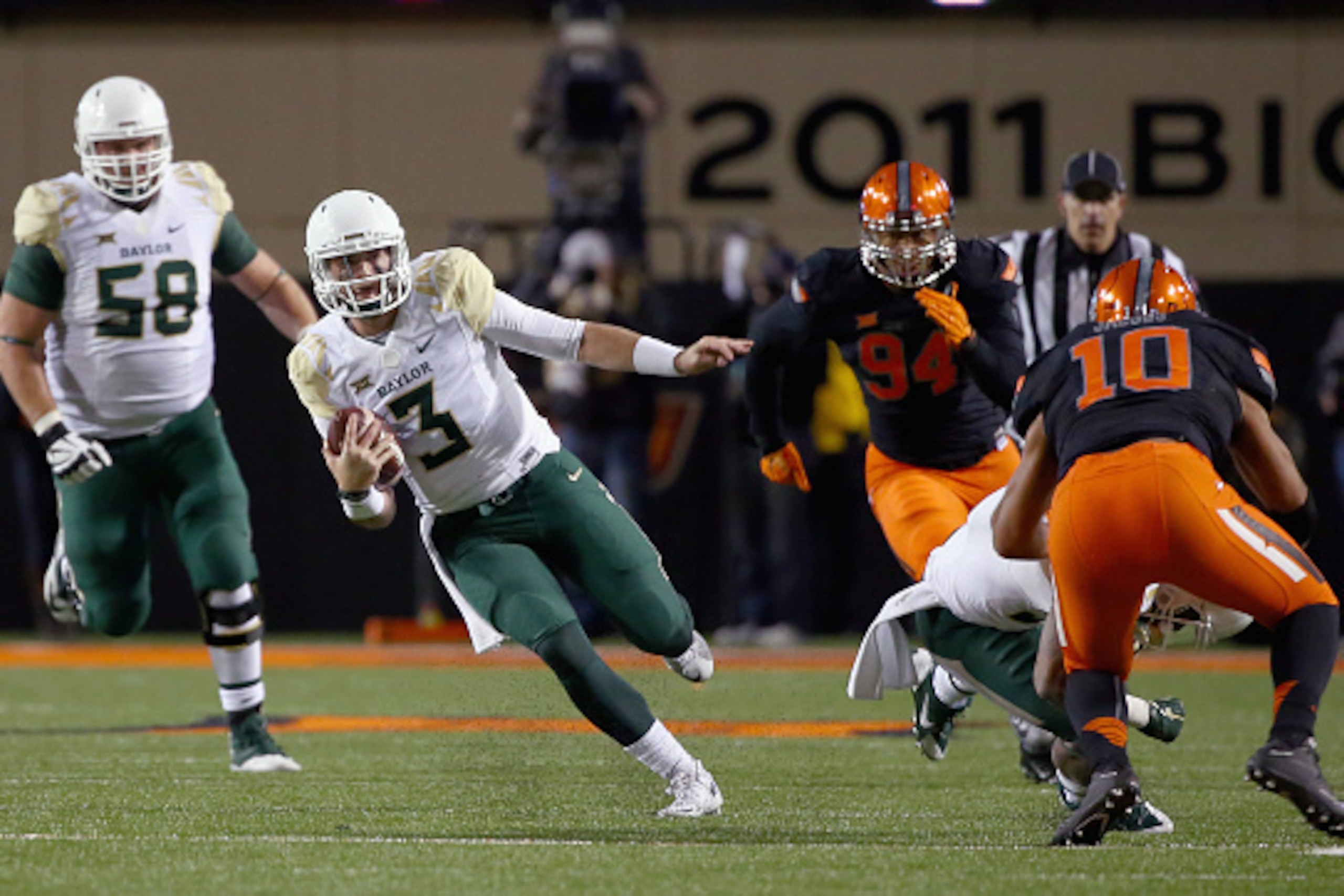STILLWATER, OK - NOVEMBER 21:  Jarrett Stidham #3 of the Baylor Bears scrambles with the ball against the Oklahoma State Cowboys in the second quarter at Boone Pickens Stadium on November 21, 2015 in Stillwater, Oklahoma.  (Photo by Tom Pennington/Getty I