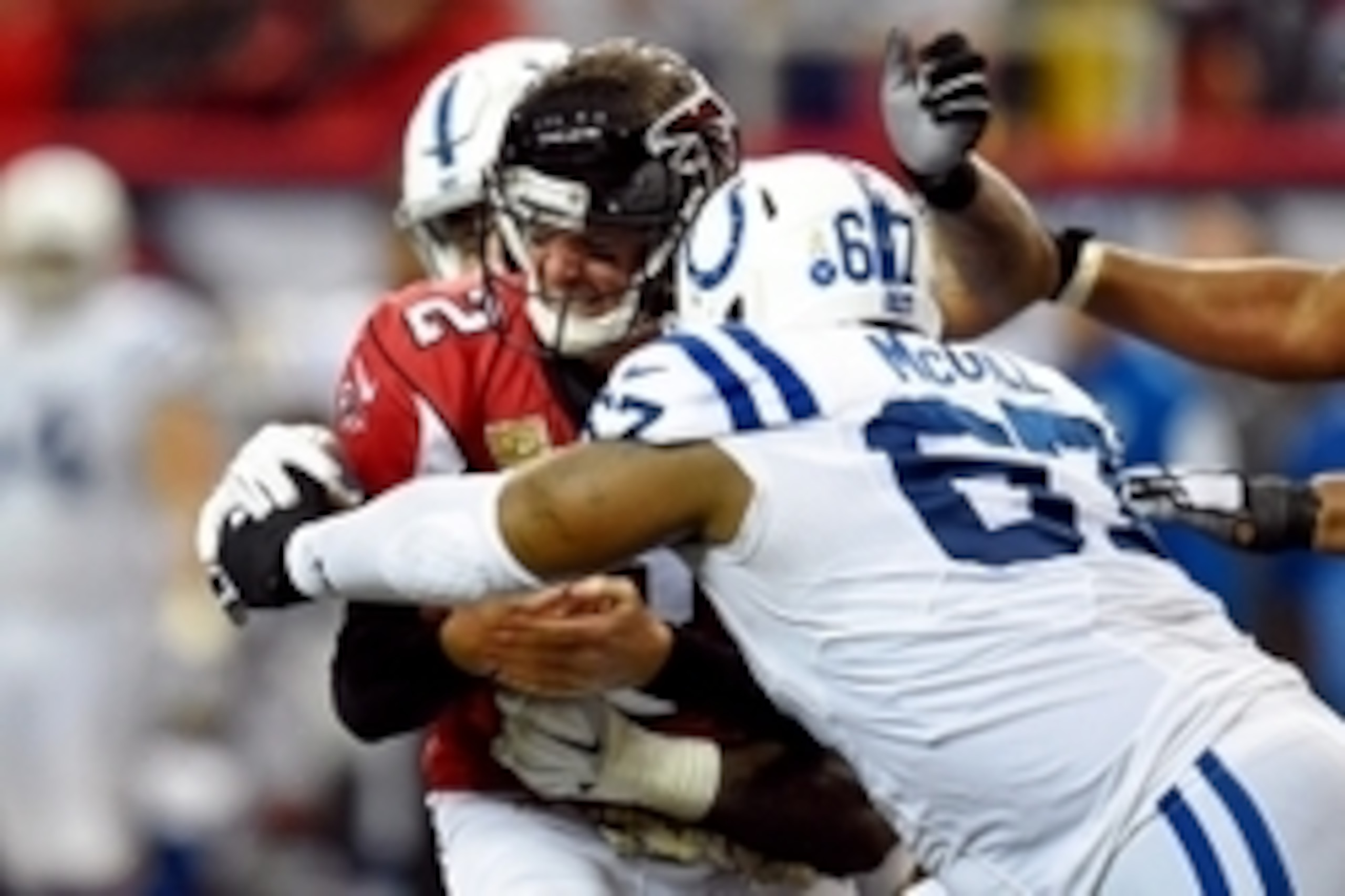Nov 22, 2015; Atlanta, GA, USA; Atlanta Falcons quarterback Matt Ryan (2) is sacked by Indianapolis Colts defensive tackle Billy Winn (99) and defensive tackle T.Y. McGill (67) during the fourth quarter at the Georgia Dome. The Colts defeated the Falcons