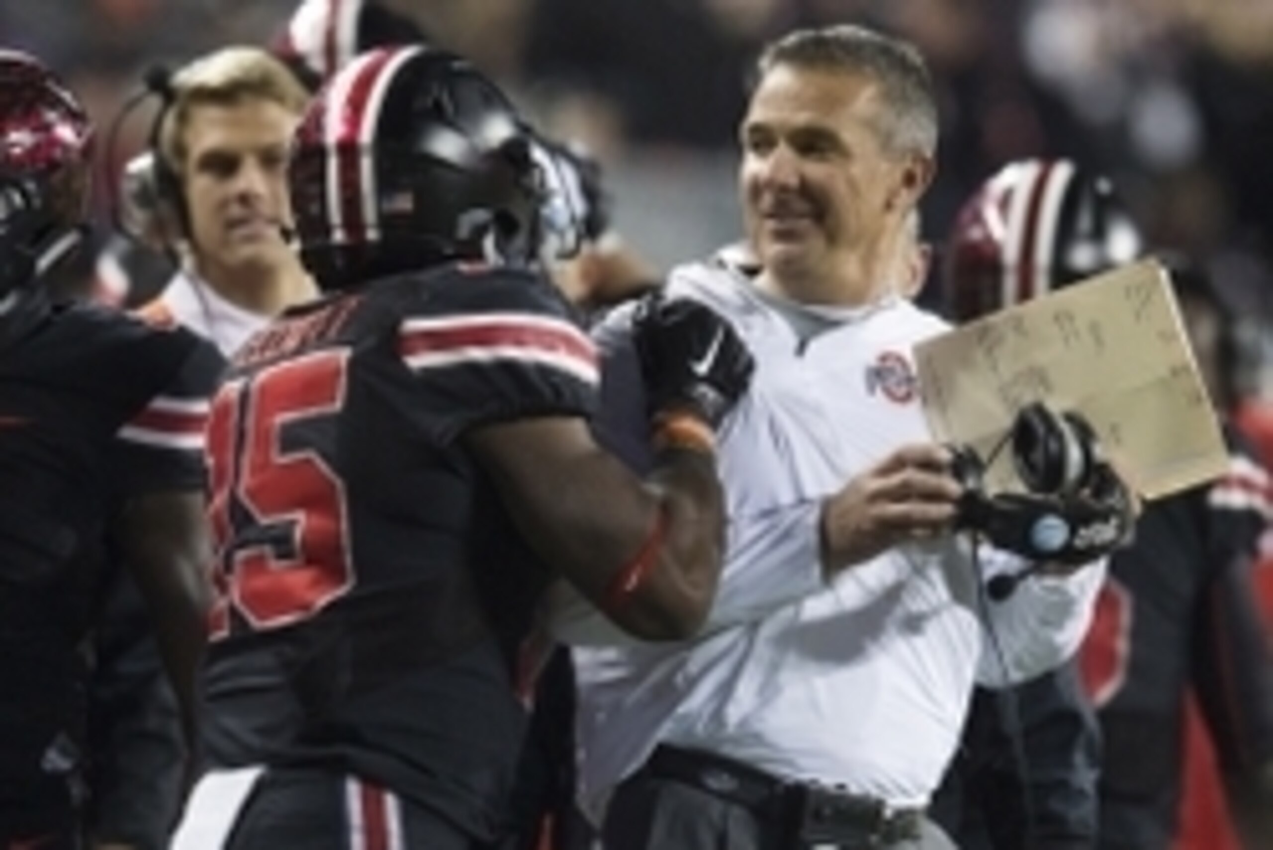 Oct 17, 2015; Columbus, OH, USA; Ohio State Buckeyes head coach Urban Meyer is congratulated by running back Ezekiel Elliott (15) after a touchdown against the Penn State Nittany Lions at Ohio Stadium. Ohio State won the game 38-10. Mandatory Credit: Greg