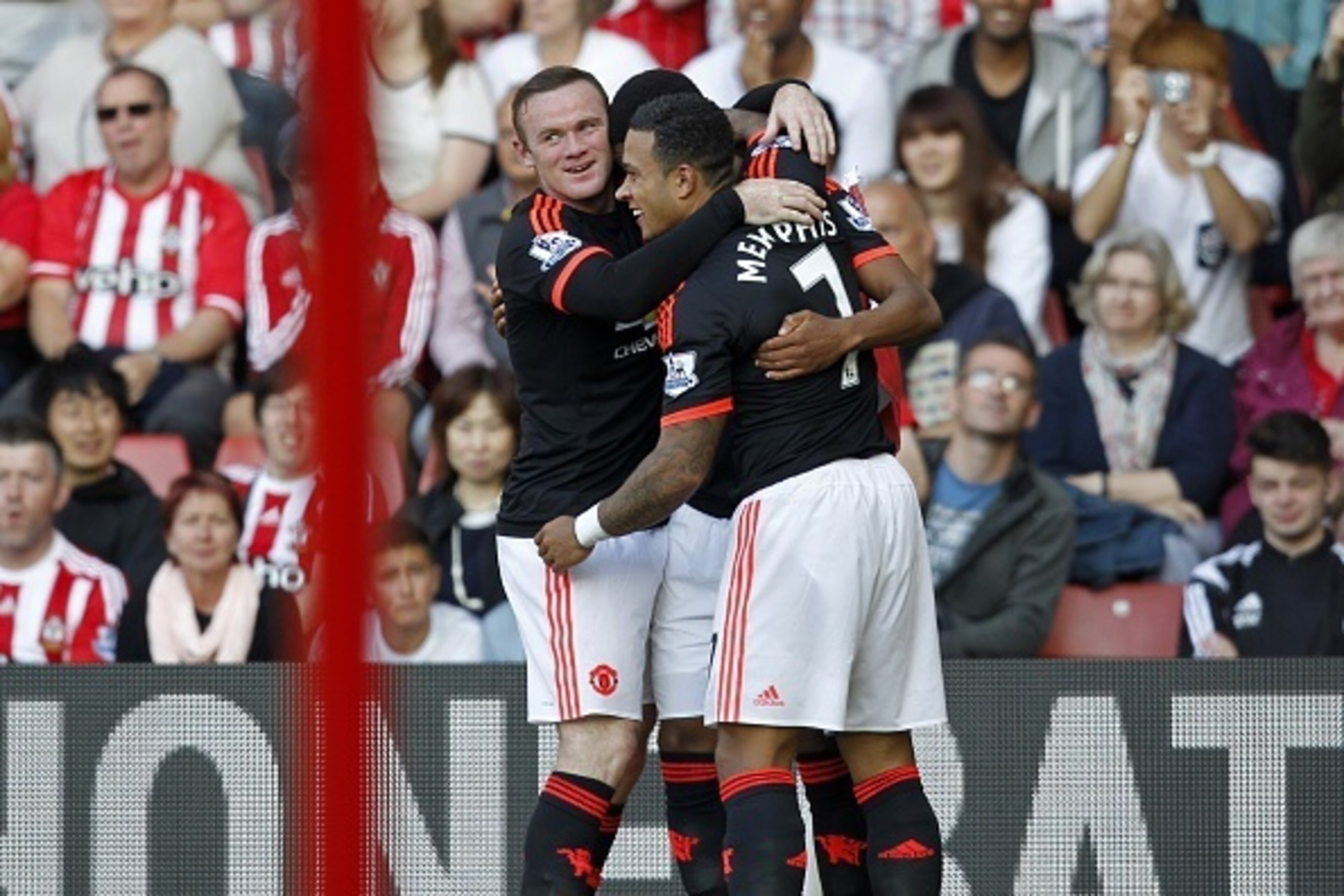 Manchester United's French striker Anthony Martial (C) celebrates with Manchester United's English striker Wayne Rooney and Manchester United's Dutch midfielder Memphis Depay (R) after scoring his second goal  during the English Premier League football ma