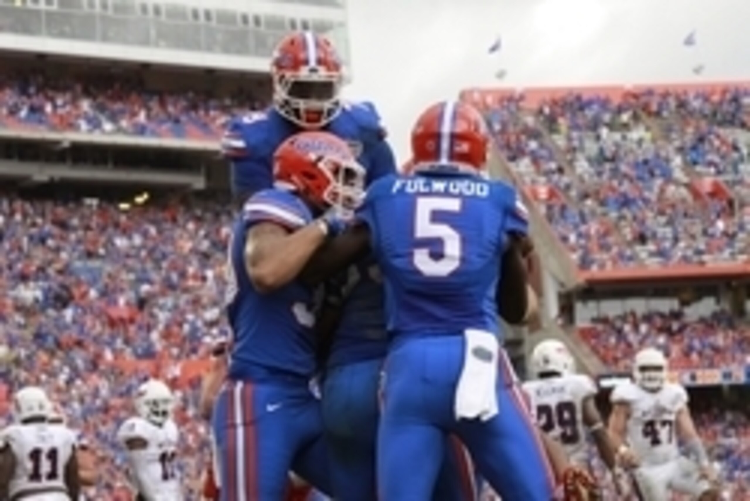 Nov 21, 2015; Gainesville, FL, USA; Florida Gators tight end Jake McGee (83) is congratulated as he scores a touchdown during overtime against the Florida Atlantic Owls at Ben Hill Griffin Stadium. Florida Gators defeated the Florida Atlantic Owls 20-14. 