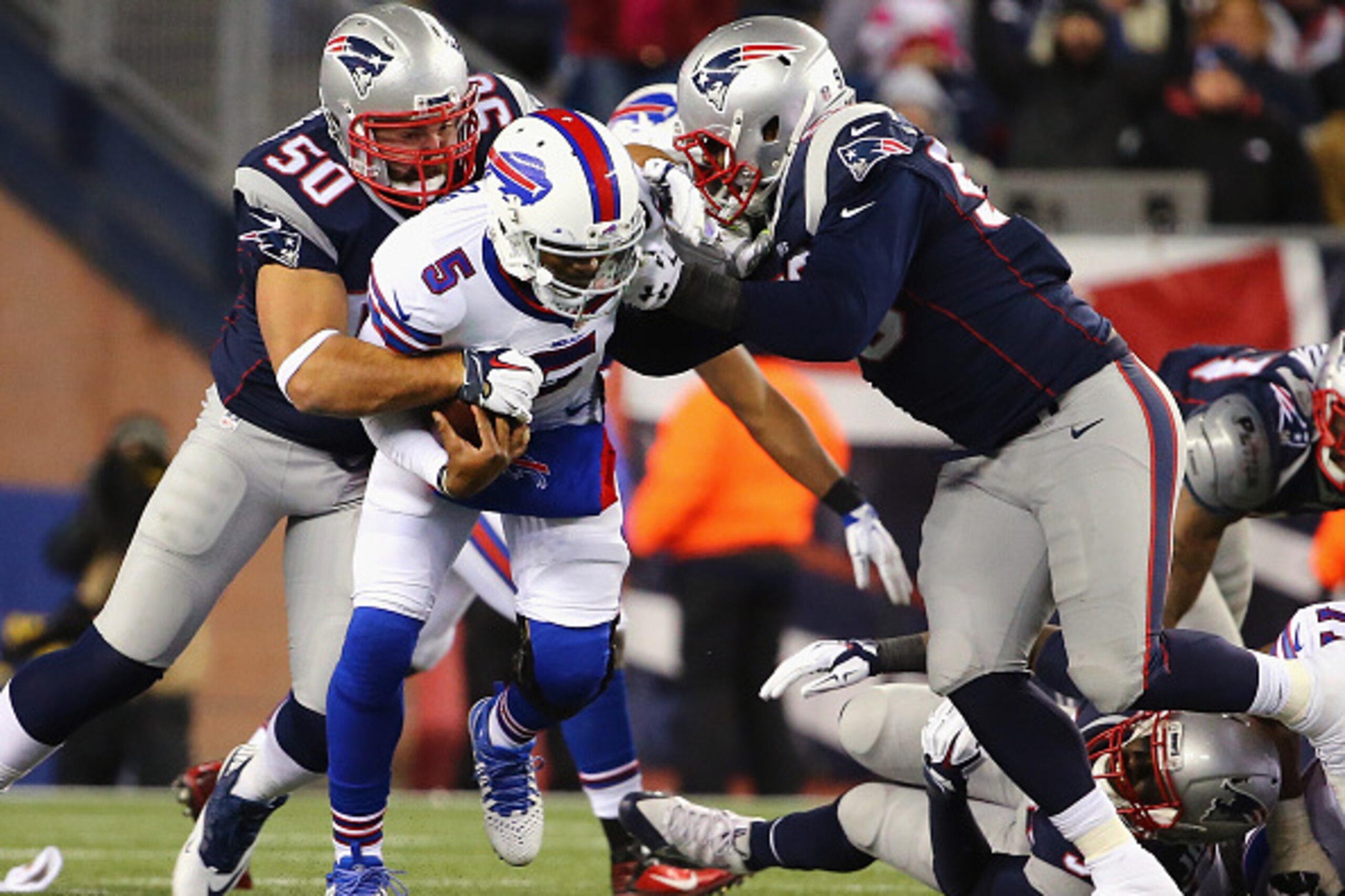 FOXBORO, MA - NOVEMBER 23:  Tyrod Taylor #5 of the Buffalo Bills is tackled by Rob Ninkovich #50 of the New England Patriots during the fourth quarter at Gillette Stadium on November 23, 2015 in Foxboro, Massachusetts.  (Photo by Maddie Meyer/Getty Images