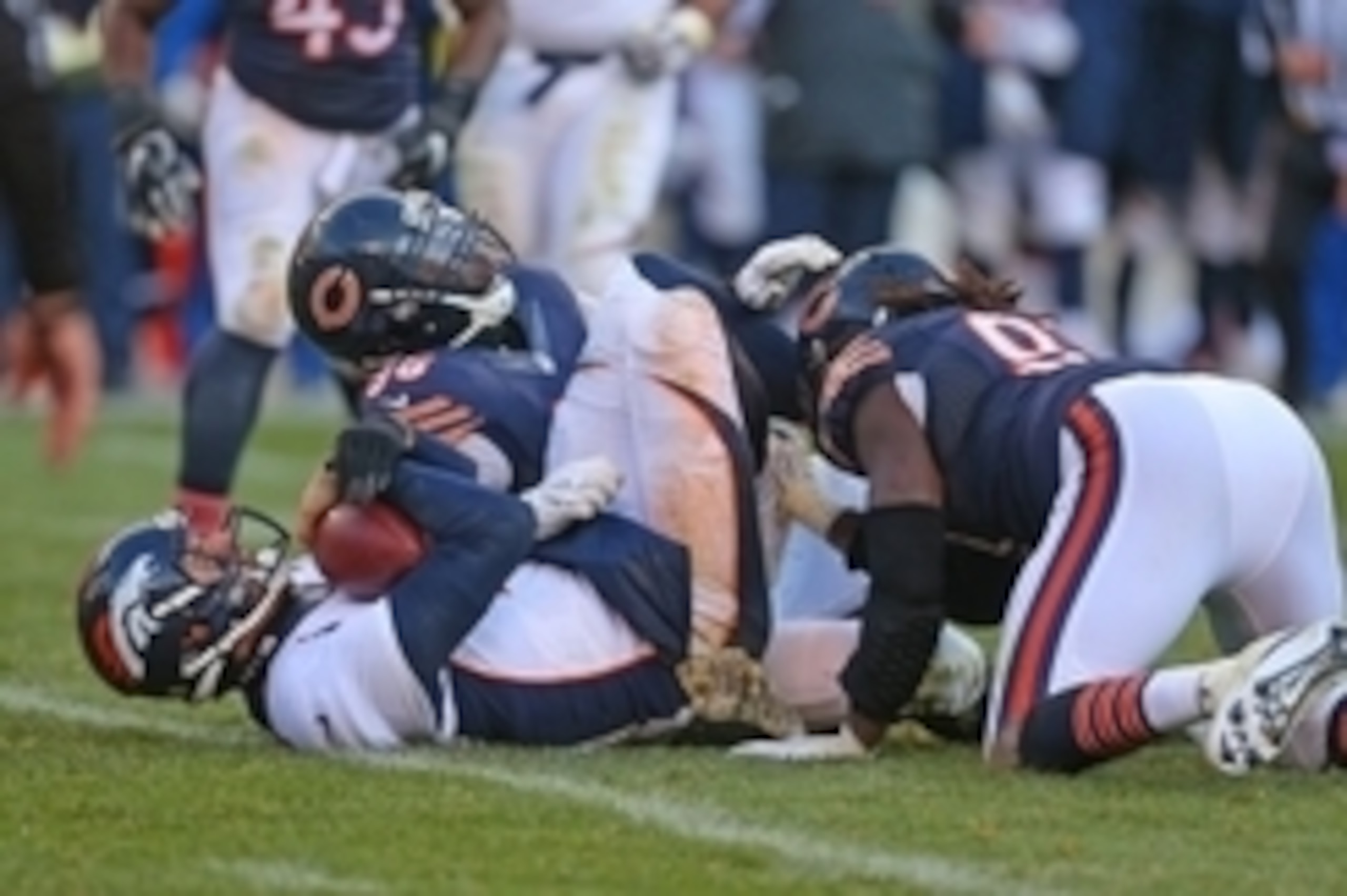 Nov 22, 2015; Chicago, IL, USA; Denver Broncos quarterback Brock Osweiler (17) is sacked by Chicago Bears defensive end Jarvis Jenkins (96) during the second half at Soldier Field. Denver won 17-15. Mandatory Credit: Dennis Wierzbicki-USA TODAY Sports