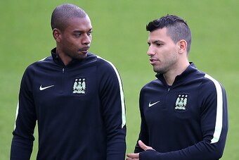 MANCHESTER, ENGLAND - SEPTEMBER 29:  Sergio Aguero chats with Fernandinho during a Manchester City training session ahead of their Champions League fixture against Borussia Moenchengladbach at City Football Academy on September 29, 2015 in Manchester, Eng