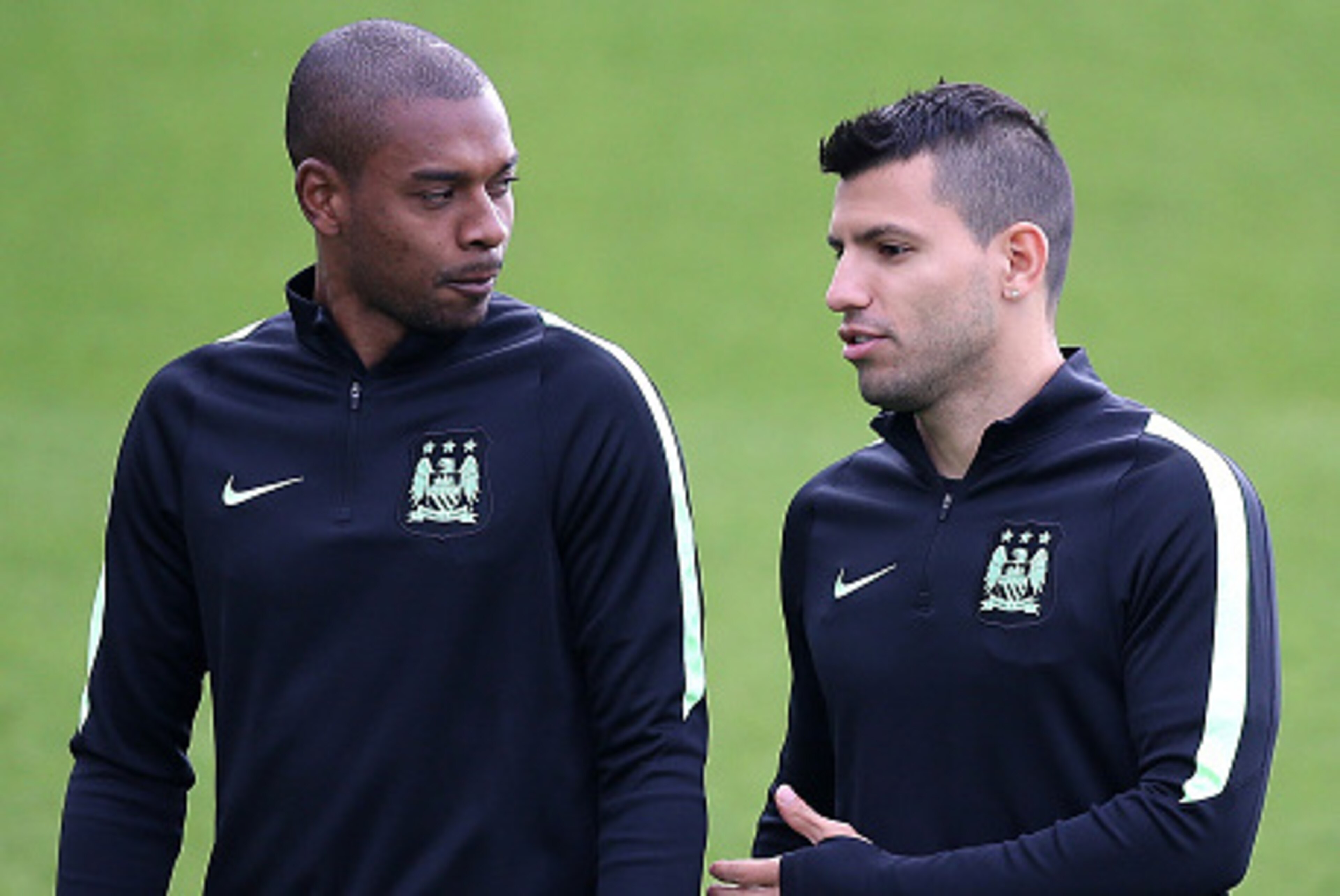 MANCHESTER, ENGLAND - SEPTEMBER 29: Sergio Aguero chats with Fernandinho during a Manchester City training session ahead of their Champions League fixture against Borussia Moenchengladbach at City Football Academy on September 29, 2015 in Manchester, Eng MANCHESTER, ENGLAND - SEPTEMBER 29: Sergio Aguero chats with Fernandinho during a Manchester City training session ahead of their Champions League fixture against Borussia Moenchengladbach at City Football Academy on September 29, 2015 in Manchester, Eng
