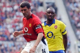MANCHESTER, United Kingdom:  (FILES) Manchester United's Roy Keane (L) blocks Arsenal's Patrick Vieira (R) during a Premiereship clash at Old Trafford, in Manchester, in this 21 September 2003 file picture. Keane left Manchester United on Friday 18 Novemb