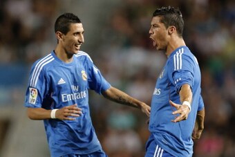 Real Madrid's Portuguese forward Cristiano Ronaldo (R) celebrates with Real Madrid's Argentinian midfielder Angel di Maria after scoring during the Spanish league football match Elche vs Real Madrid at the Manuel Martines Valero Stadium in Elche on Septem