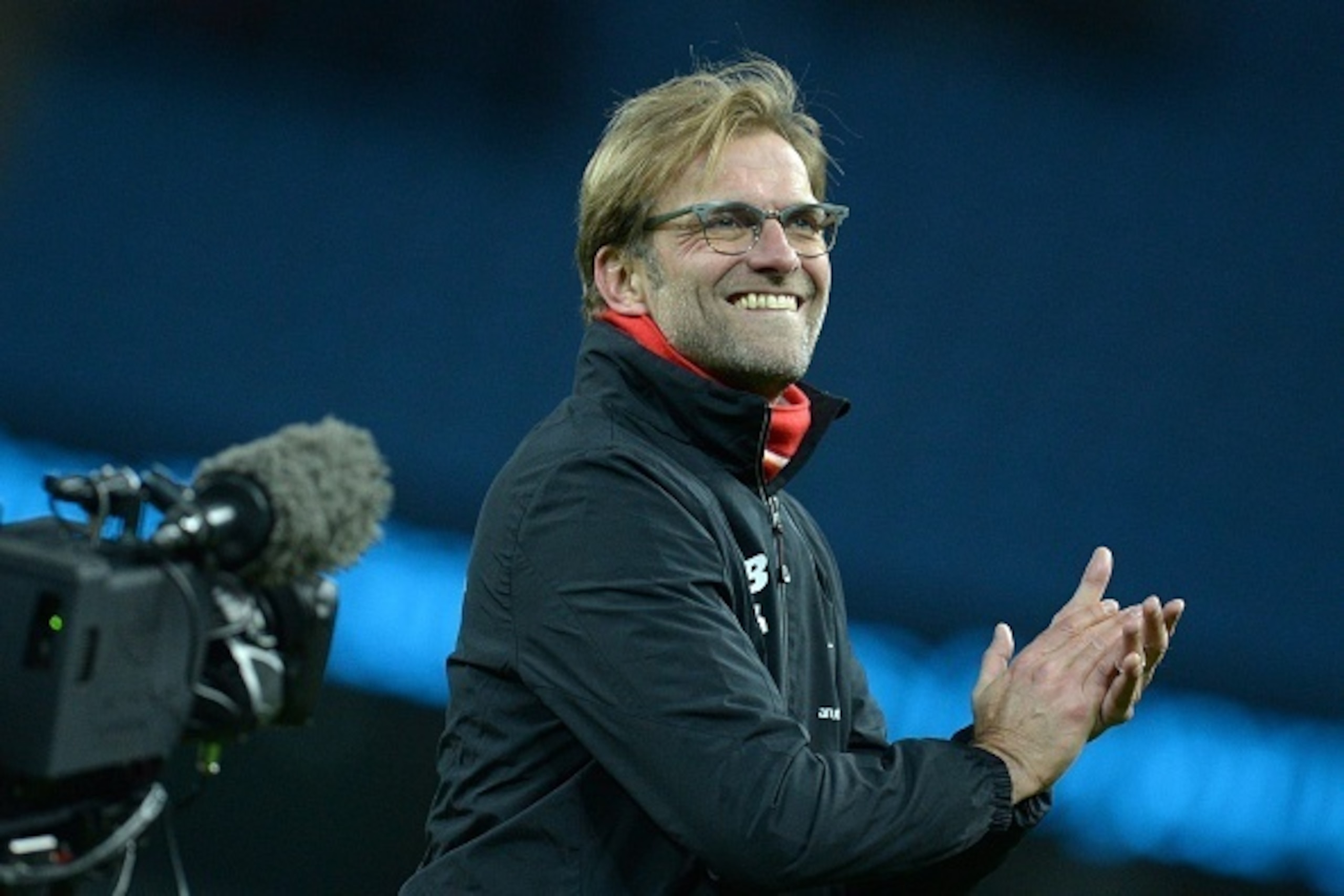 Liverpool's German manager Jurgen Klopp gestures to supporters after the English Premier League football match between Manchester City and Liverpool at The Etihad stadium in Manchester, north west England on November 21, 2015. Liverpool won the game 4-1. 