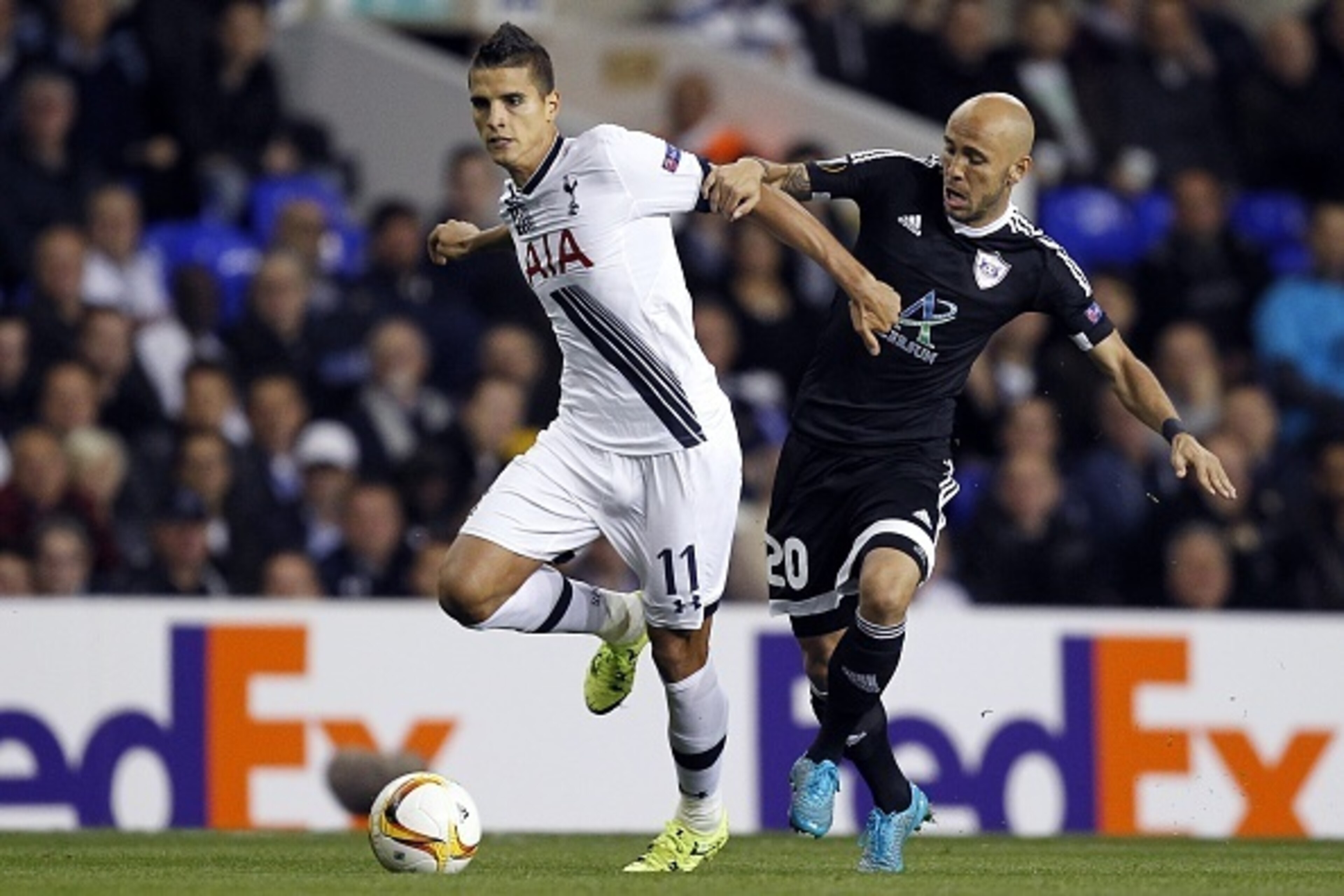 Tottenham Hotspur's Argentinian midfielder Erik Lamela (L) vies for the ball with Qarabag's Brazilian midfielder Richard Almeida during the UEFA Europa League Group J football match between Tottenham Hotspur FC and Qarabag FK on September 17, 2015, at Wh Tottenham Hotspur's Argentinian midfielder Erik Lamela (L) vies for the ball with Qarabag's Brazilian midfielder Richard Almeida during the UEFA Europa League Group J football match between Tottenham Hotspur FC and Qarabag FK on September 17, 2015, at Wh