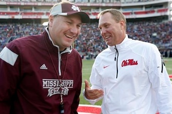 Mississippi State head coach Dan Mullen (left) and Ole Miss head coach Hugh Freeze (right)