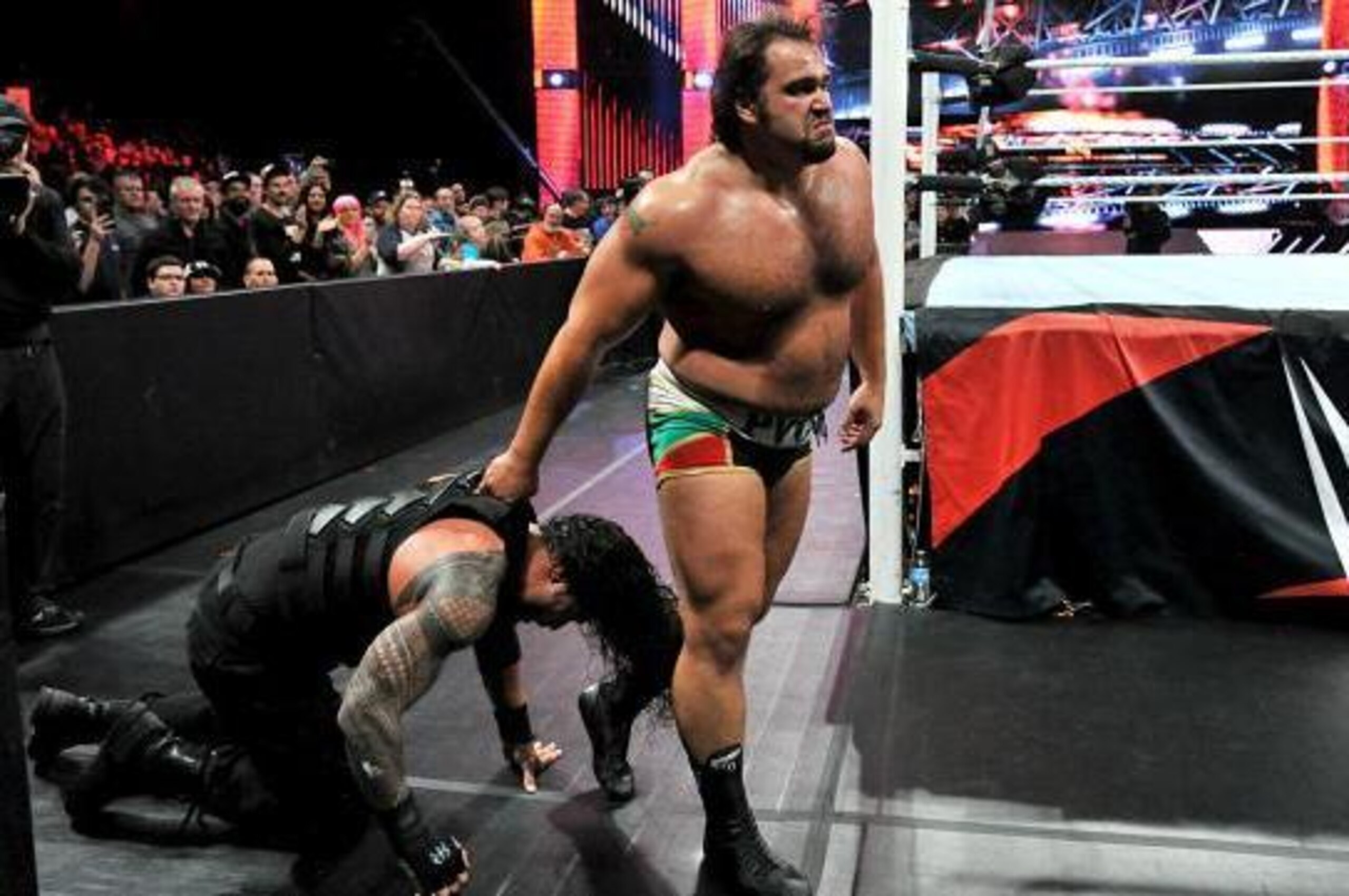 Rusev on the attack against Roman Reigns.