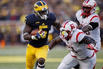 ANN ARBOR, MI - NOVEMBER 07:  Jabrill Peppers #5 of the Michigan Wolverines gets past the tackle of Sebastian Joseph #51 of the Rutgers Scarlet Knights and runs for a second quarter touchdown on November 7, 2015 at Michigan Stadium in Ann Arbor, Michigan.