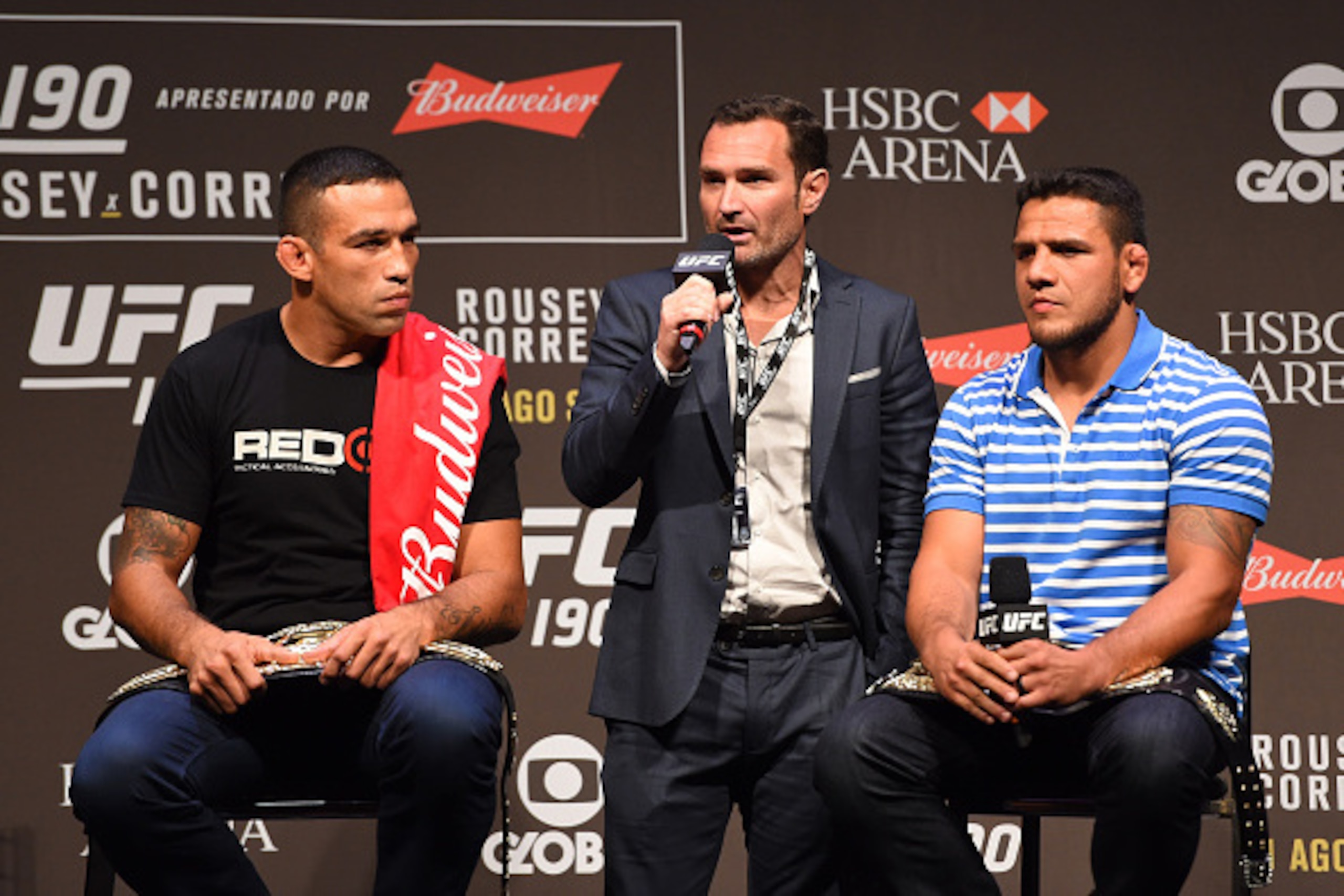 RIO DE JANEIRO, BRAZIL - JULY 31:  (L-R) UFC heavyweight champion Fabricio Werdum, Senior Vice President and General Manager of Brazil Giovani Decker, and UFC lightweight champion Rafael Dos Anjos interact with the media during the UFC 190 weigh-in inside