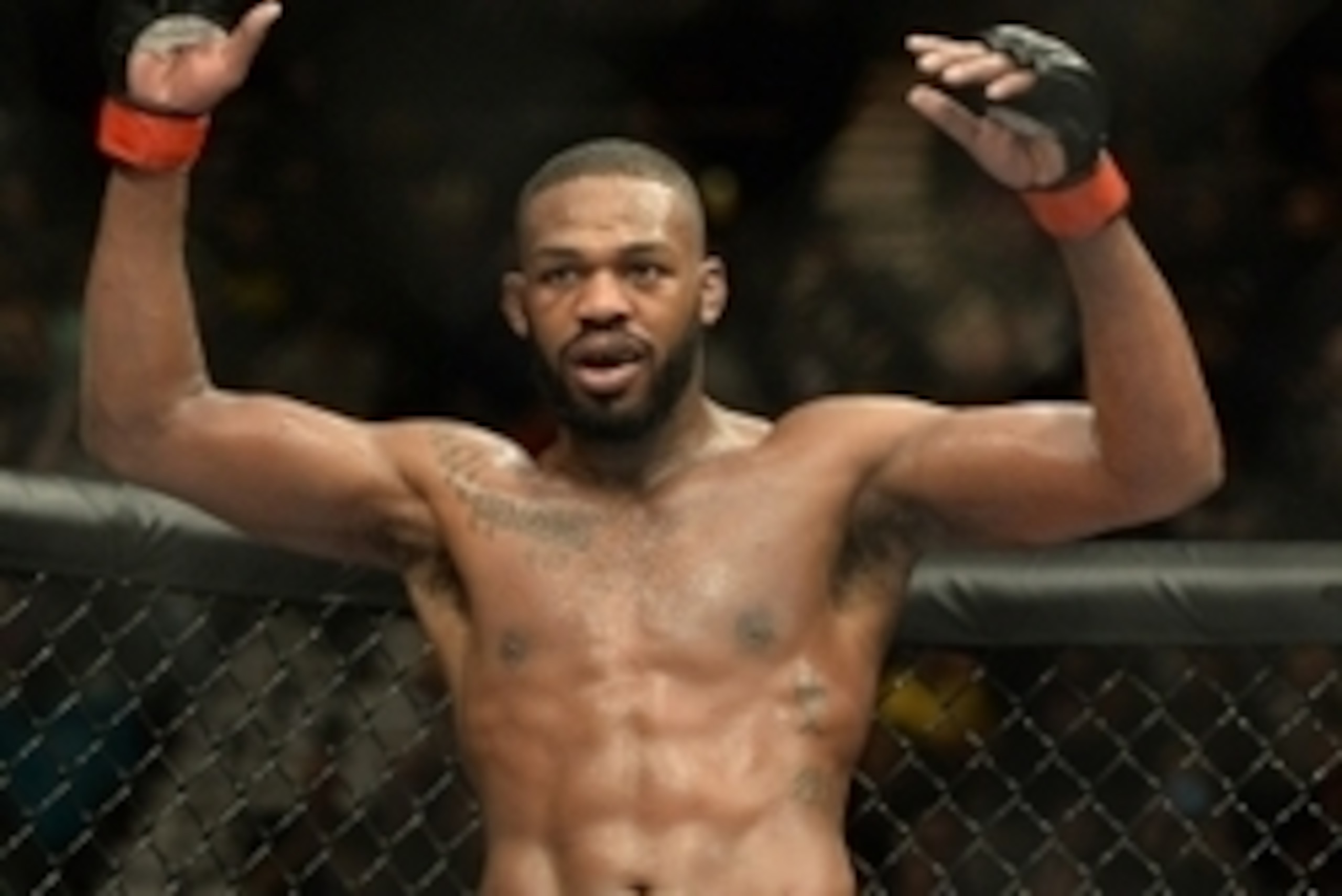 Jan 3, 2015; Las Vegas, NV, USA; Jon Jones (red gloves) celebrates after defeating Daniel Cormier (not pictured) in their light heavyweight title fight at UFC 182 at the MGM Grand Garden Arena. Jones won. Mandatory Credit: Jayne Kamin-Oncea-USA TODAY Spor