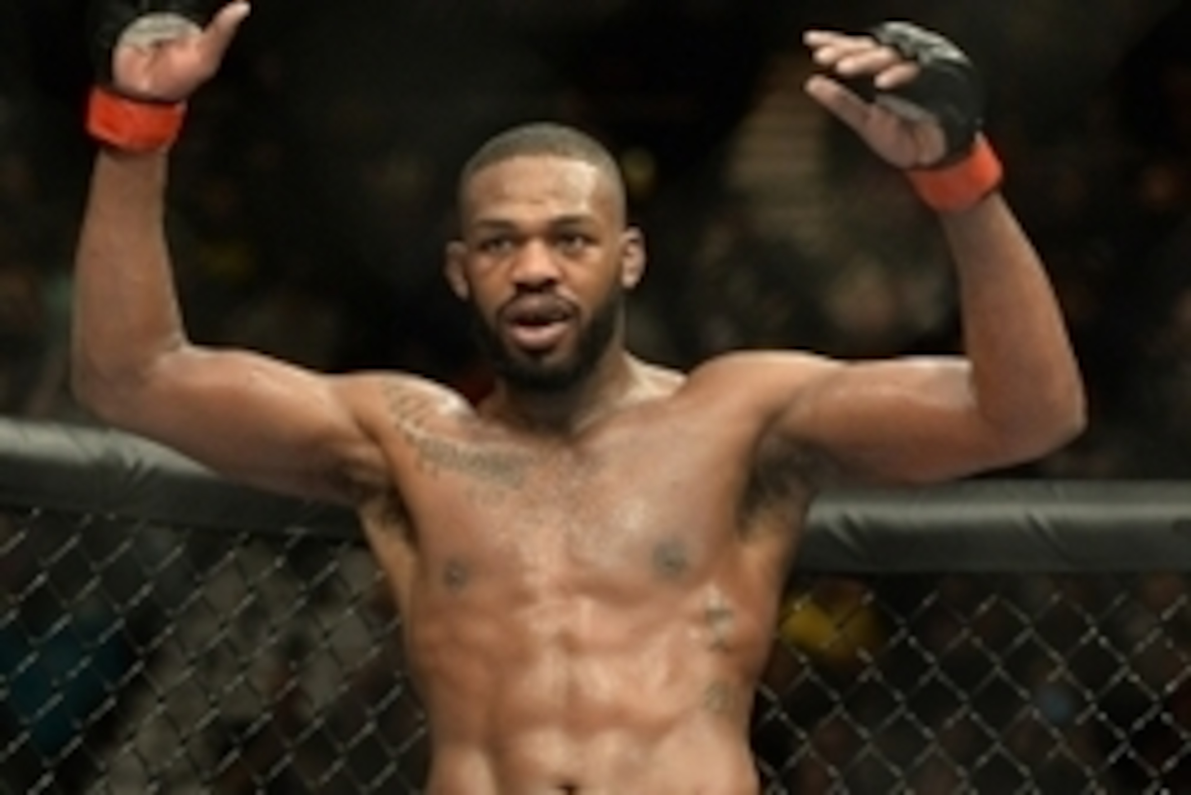 Jan 3, 2015; Las Vegas, NV, USA; Jon Jones (red gloves) celebrates after defeating Daniel Cormier (not pictured) in their light heavyweight title fight at UFC 182 at the MGM Grand Garden Arena. Jones won. Mandatory Credit: Jayne Kamin-Oncea-USA TODAY Spor