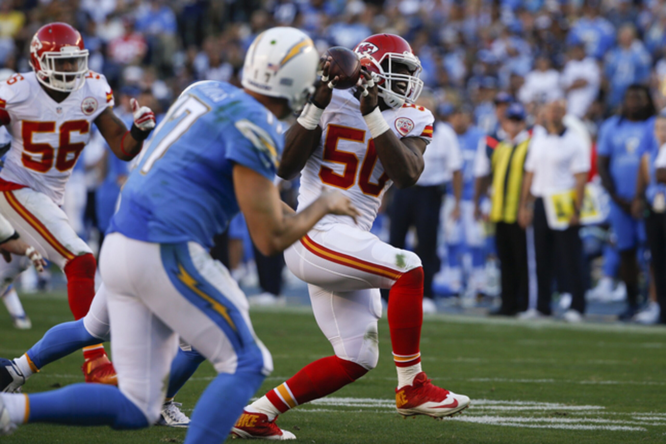 Justin Houston (No. 50) intercepts Philip Rivers.