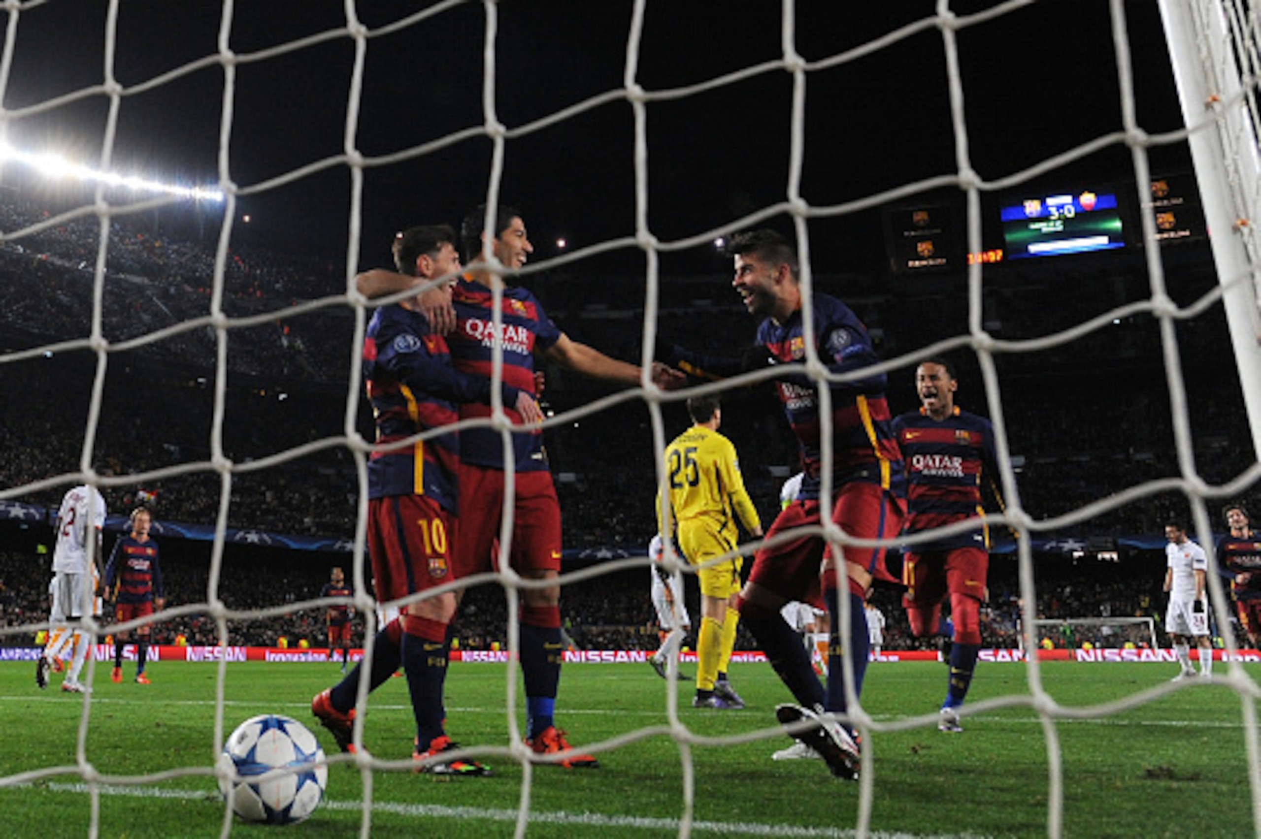 BARCELONA, SPAIN - NOVEMBER 24:  Gerard Pique (2ndR) of Barcelona celebrates scoring his teams fourth goal with Luis Suarez, Lionel Messi and Neymar during the UEFA Champions League Group E match between FC Barcelona and AS Roma at Camp Nou on November 24
