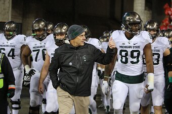 COLUMBUS, OH - NOVEMBER 21: H6ead coach Mark Dantonio of the Michigan State Spartans leads his team onto the field before the start of the third quarter against the Ohio State Buckeyes at Ohio Stadium on November 21, 2015 in Columbus, Ohio. (Photo by Rey 