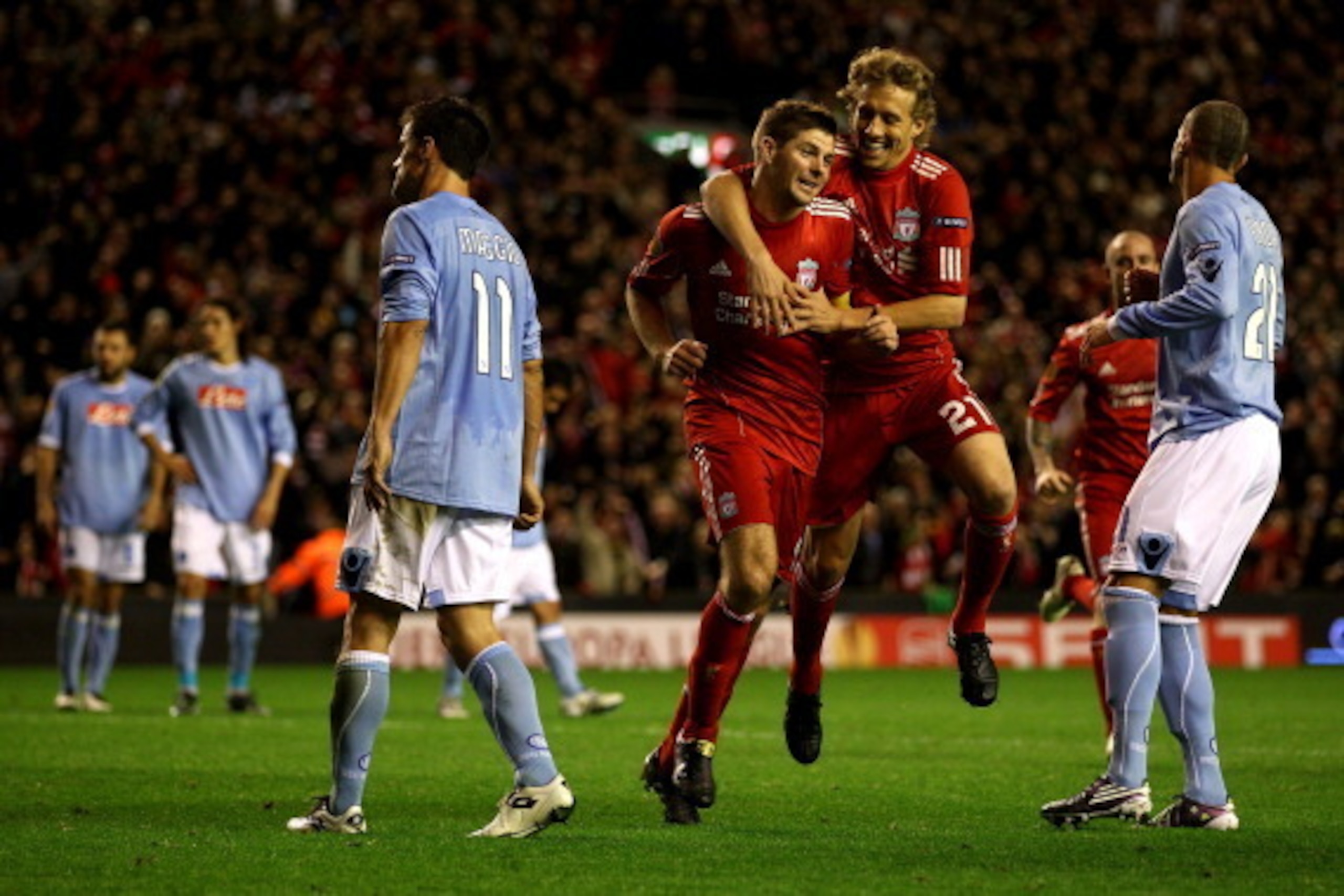 LIVERPOOL, ENGLAND - NOVEMBER 04:  Steven Gerrard of Liverpool celebrates scoring his team's third goal and his hat trick with team mate Lucas (R) during the UEFA Europa League Group K match beteween Liverpool and SSC Napoli at Anfield on November 4, 2010