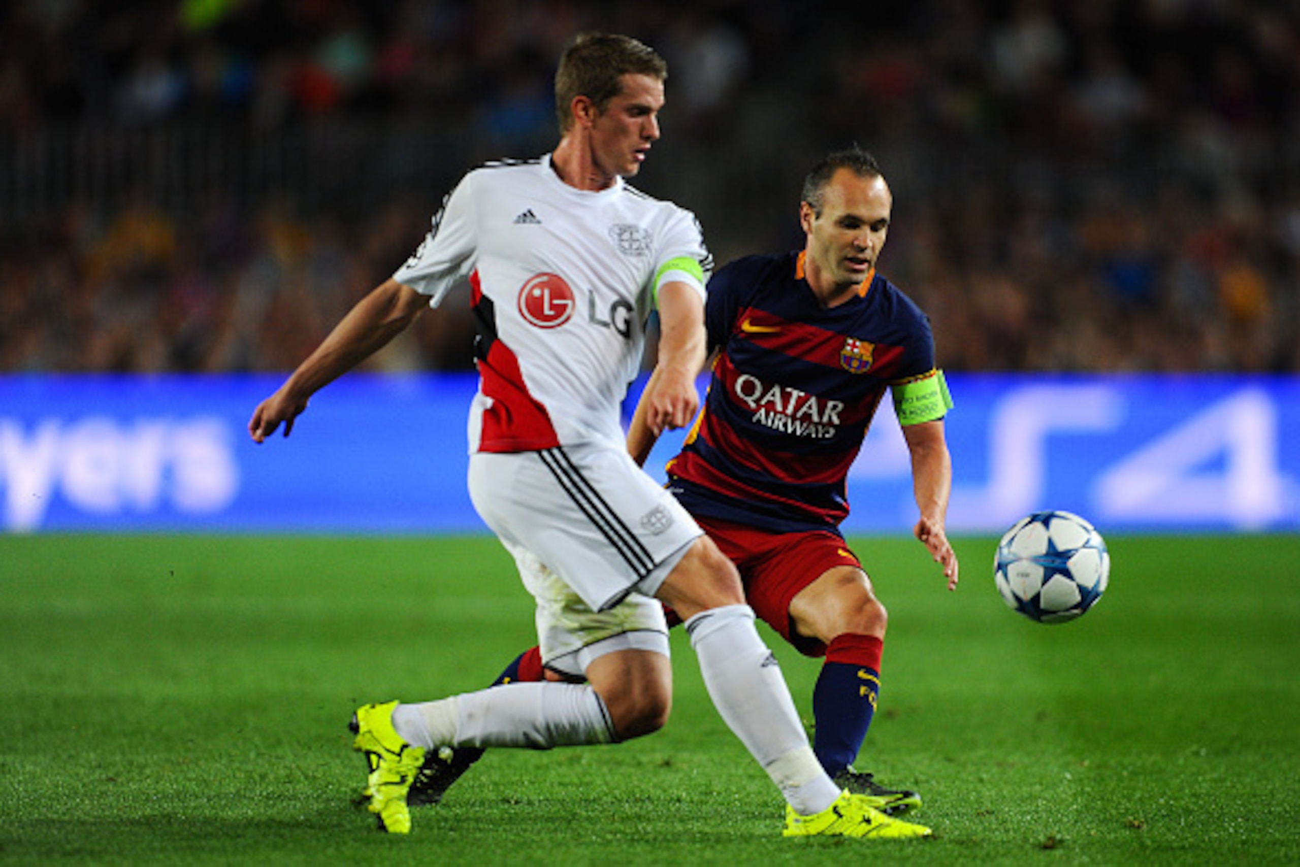 BARCELONA, SPAIN - SEPTEMBER 29:  Lars Bender of Bayer 04 Leverkusen competes for the ball with Andres Iniesta of FC Barcelona during the UEFA Champions League Group E match between FC Barcelona and Bayer 04 Leverkusen on September 29, 2015 in Barcelona, 
