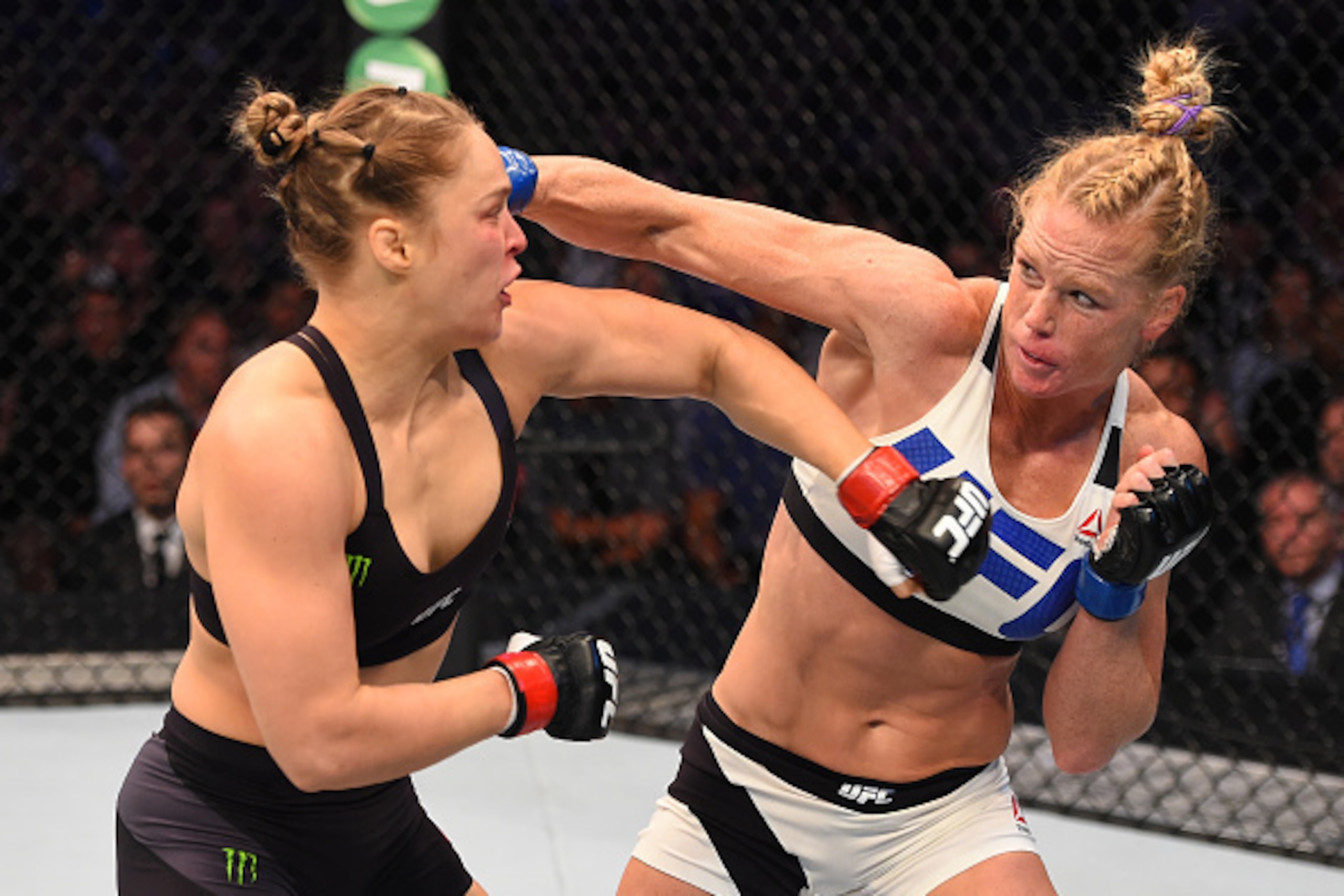MELBOURNE, AUSTRALIA - NOVEMBER 15:  (R-L) Holly Holm of the United States punches Ronda Rousey of the United States in their UFC women's bantamweight championship bout during the UFC 193 event at Etihad Stadium on November 15, 2015 in Melbourne, Australi