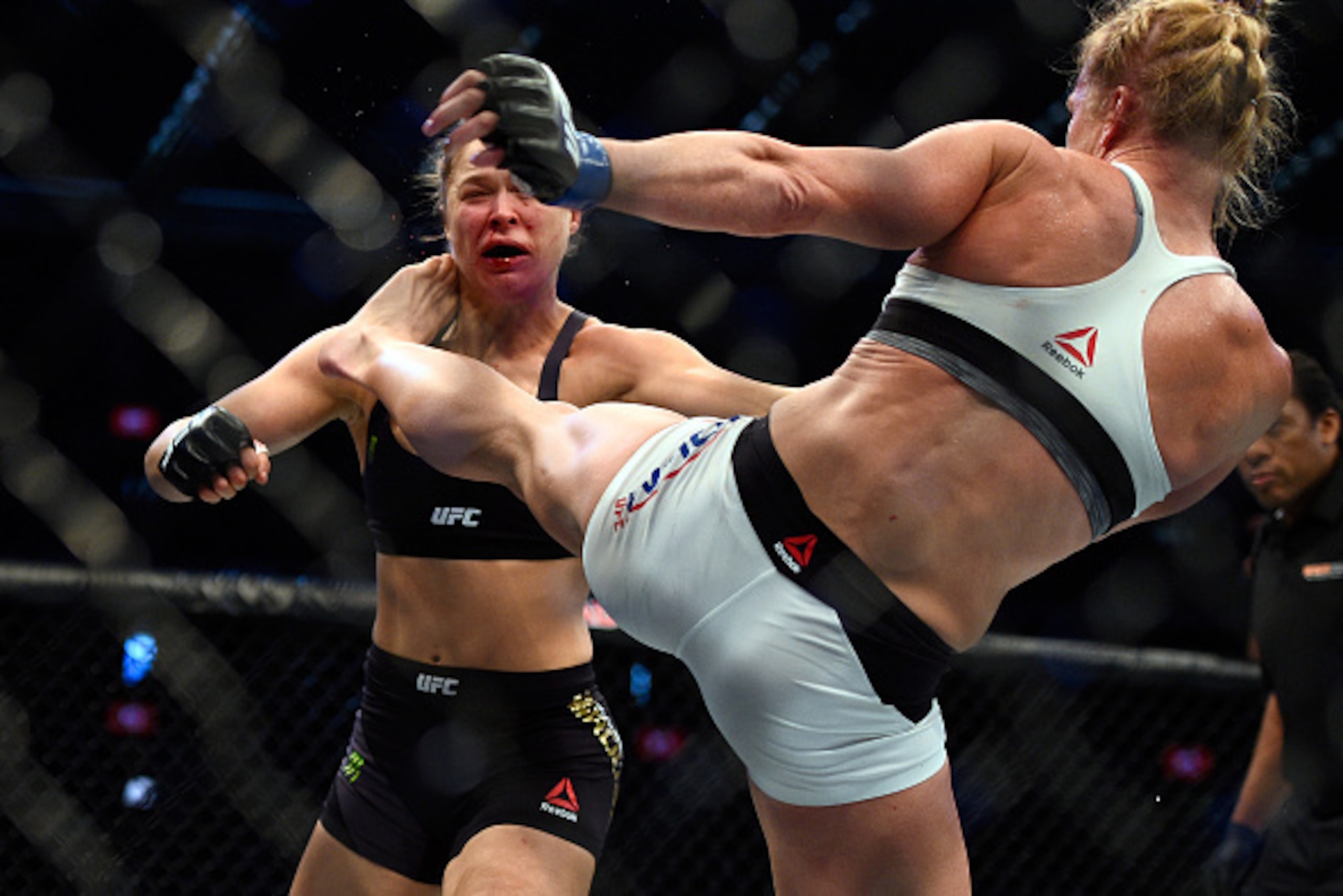 MELBOURNE, AUSTRALIA - NOVEMBER 15:  (R-L) Holly Holm kicks Ronda Rousey in their UFC women's bantamweight championship bout during the UFC 193 event at Etihad Stadium on November 15, 2015 in Melbourne, Australia. (Photo by Jeff Bottari/Zuffa LLC/Zuffa LL