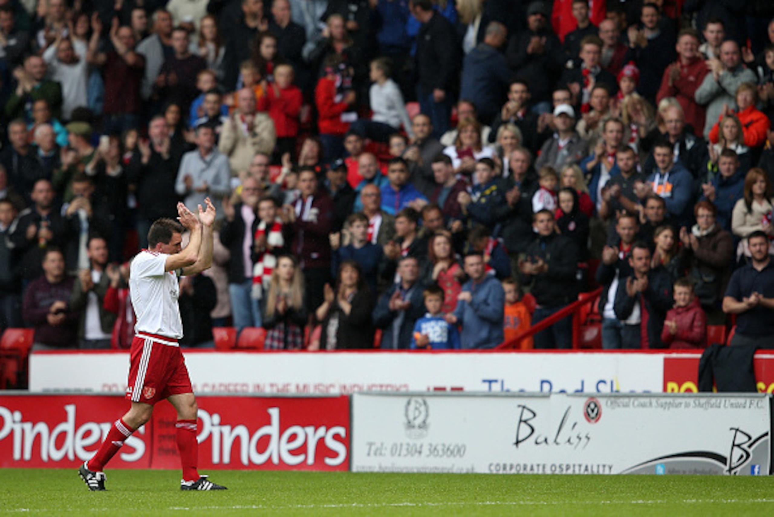 SHEFFIELD, ENGLAND - JULY 26:  Chris Morgan of Sheffield United  applauds the fans after making his final appearance in club colors during the pre season friendly match between Sheffield United and Newcastle United at Bramall Lane on July 26, 2015 in Shef