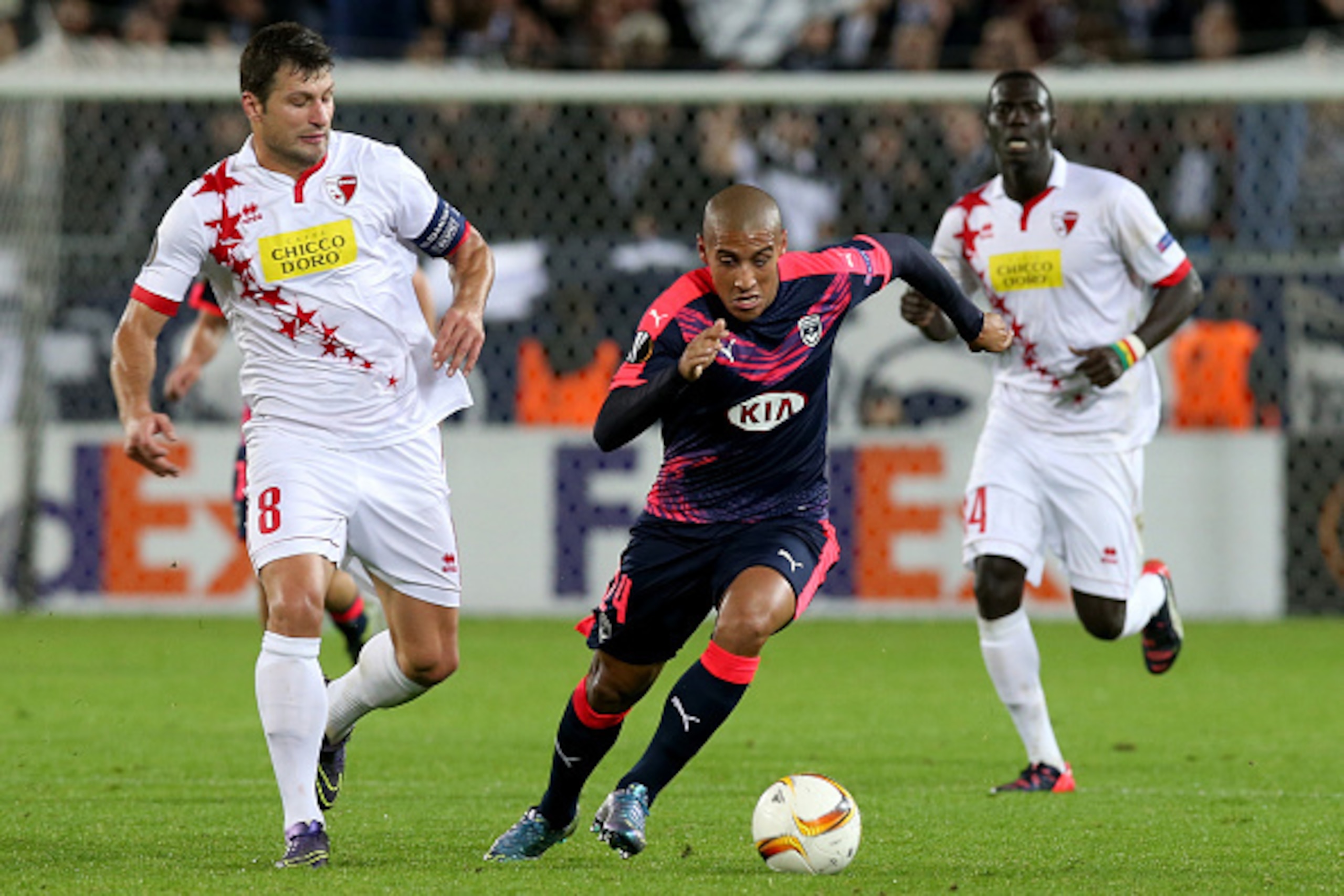 BORDEAUX, FRANCE - OCTOBER 22: Wahbi Khazri (R) for FC Girondins de Bordeaux and Veroljub Salatic in action during the Europa League game between FC Girondins de Bordeaux and FC Sion at Matmut Atlantique Stadium  on October 22, 2015 in Bordeaux, France.  