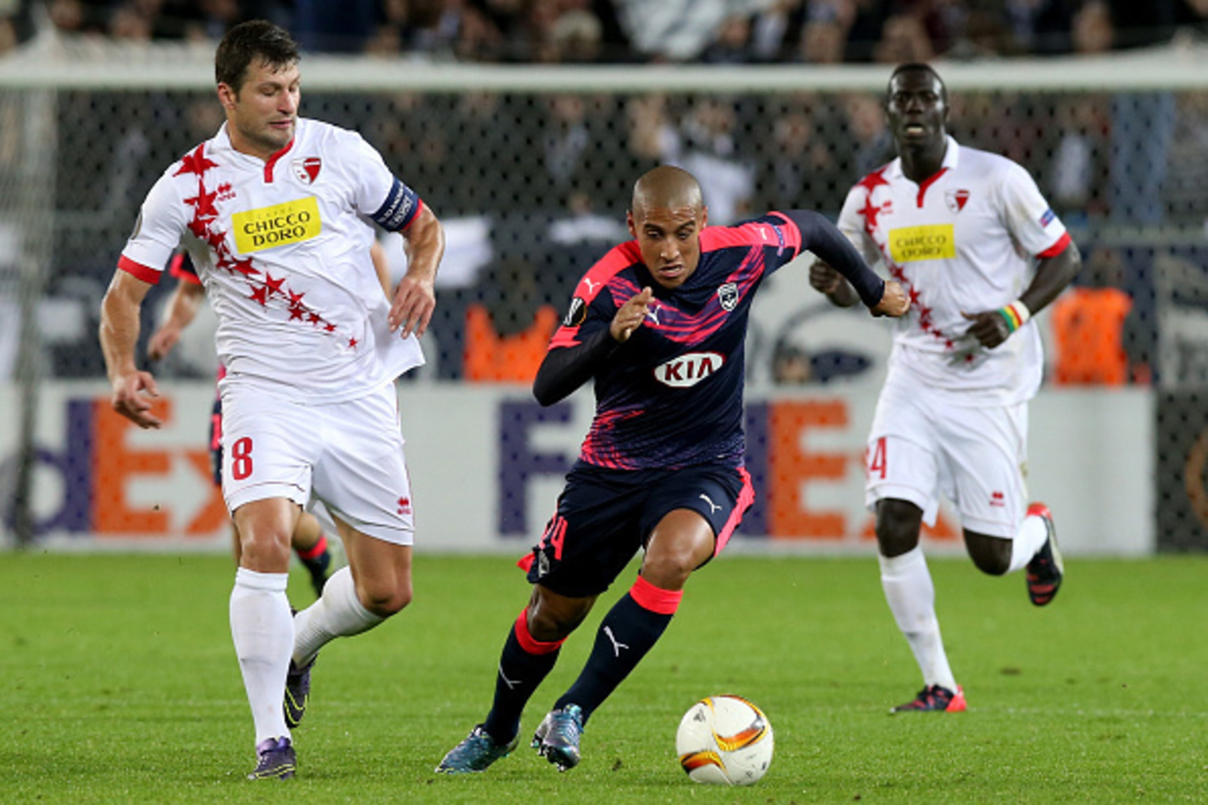 BORDEAUX, FRANCE - OCTOBER 22: Wahbi Khazri (R) for FC Girondins de Bordeaux and Veroljub Salatic in action during the Europa League game between FC Girondins de Bordeaux and FC Sion at Matmut Atlantique Stadium  on October 22, 2015 in Bordeaux, France.  
