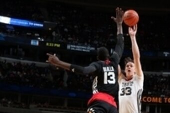 Apr 1, 2015; Chicago, IL, USA;  McDonalds High School All American West boys center Stephen Zimmerman Jr. (33) takes a shot against East center Cheick Diallo (13) during the McDonalds High School All American Games at the United Center. Mandatory Credit: 