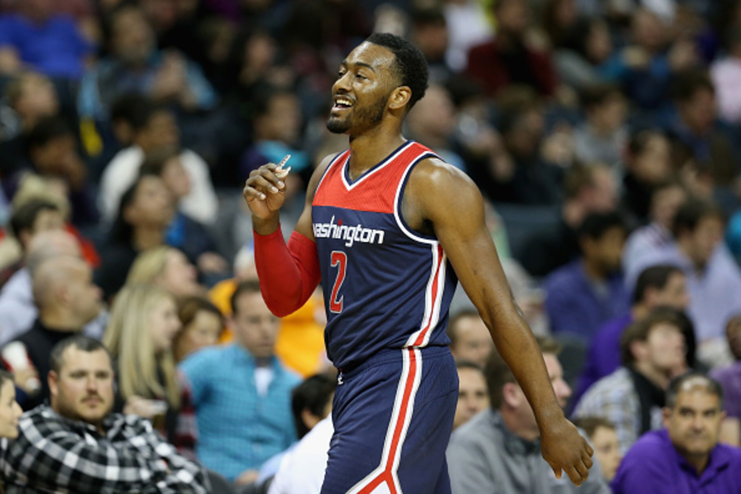 CHARLOTTE, NC - NOVEMBER 25:  John Wall #2 of the Washington Wizards reacts during their game against the Charlotte Hornets at Time Warner Cable Arena on November 25, 2015 in Charlotte, North Carolina.  NBA - NOTE TO USER: User expressly acknowledges and 