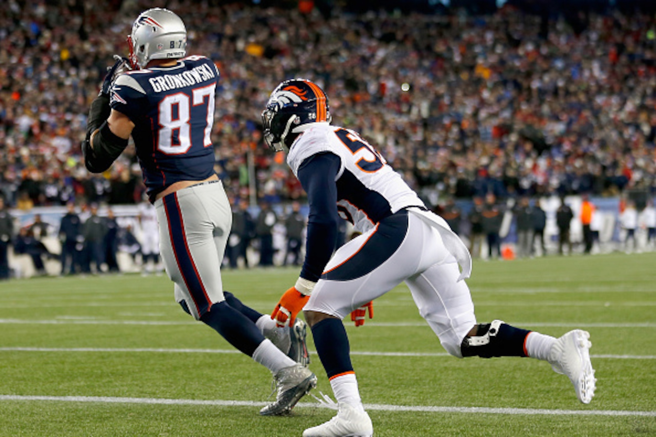 FOXBORO, MA - NOVEMBER 02:  Rob Gronkowski #87 of the New England Patriots catches a touchdown pass during the fourth quater against the Denver Broncos at Gillette Stadium on November 2, 2014 in Foxboro, Massachusetts.  (Photo by Jim Rogash/Getty Images)