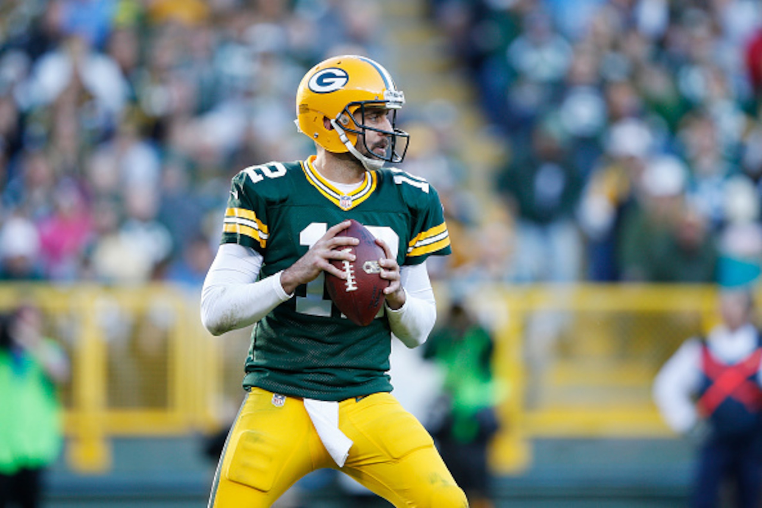 GREEN BAY, WI - NOVEMBER 15: Aaron Rodgers #12 of the Green Bay Packers looks to pass against the Detroit Lions during a game at Lambeau Field on November 15, 2015 in Green Bay, Wisconsin. The Lions defeated the Packers 18-16. (Photo by Joe Robbins/Getty 