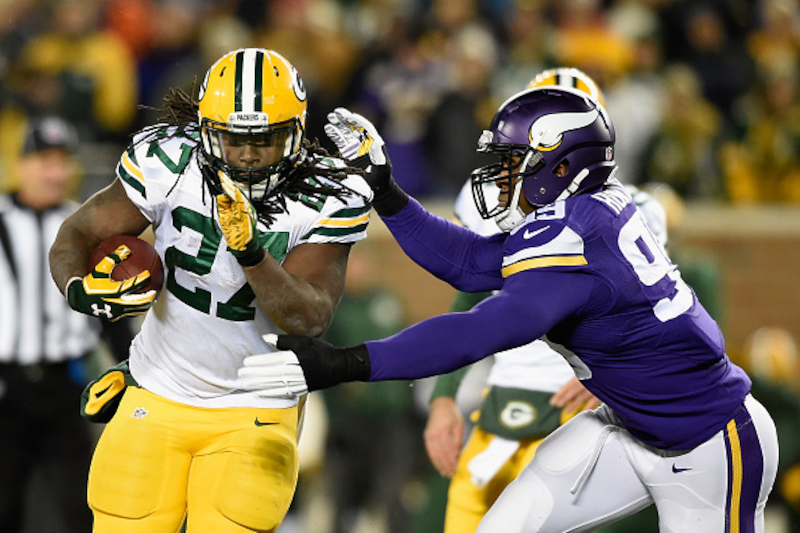 MINNEAPOLIS, MN - NOVEMBER 22: Danielle Hunter #99 of the Minnesota Vikings ties up Eddie Lacy #27 of the Green Bay Packers during the third quarter of the game on November 22, 2015 at TCF Bank Stadium in Minneapolis, Minnesota. The Packers defeated the V