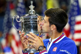 NEW YORK, NY - SEPTEMBER 13:  Novak Djokovic of Serbia celebrates with the winner's trophy after defeating Roger Federer of Switzerland during their Men's Singles Final match on Day Fourteen of the 2015 US Open at the USTA Billie Jean King National Tennis