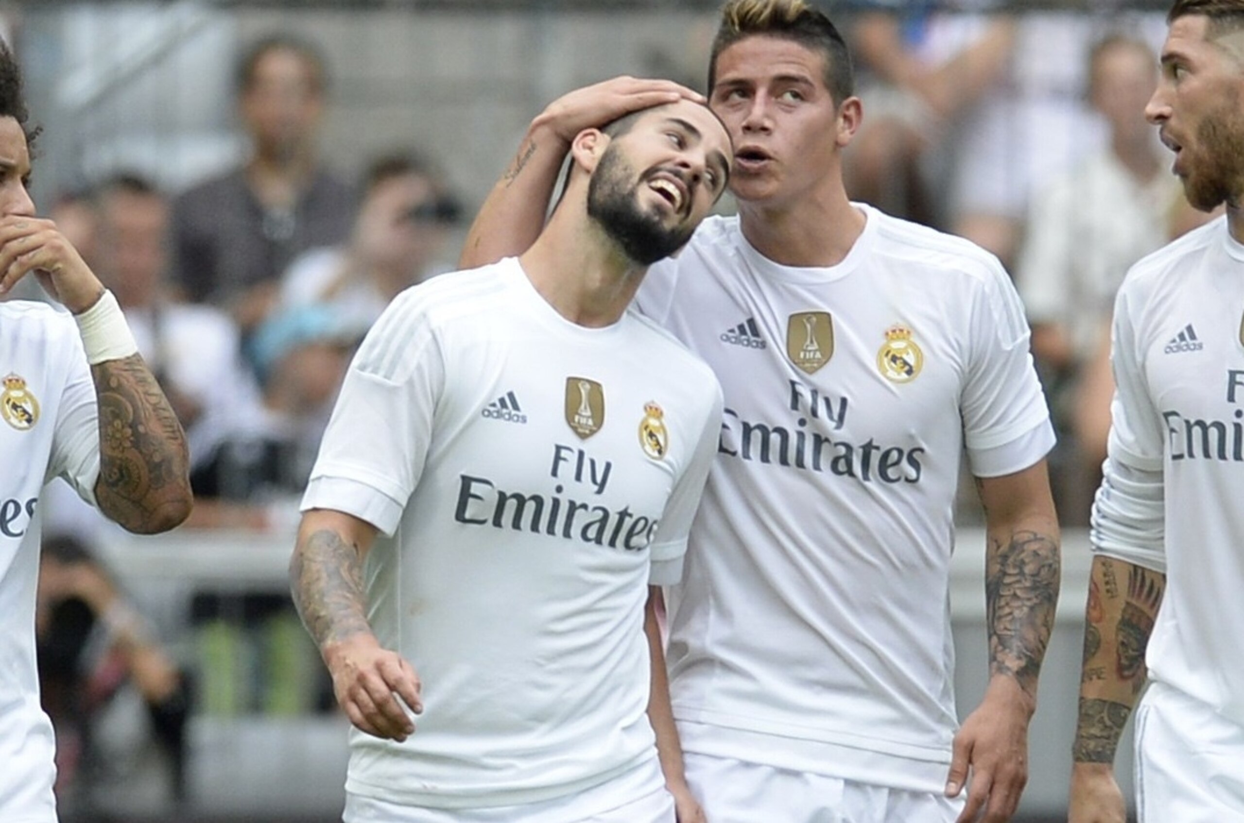 (L-R) Real Madrid's Brazilian defender Marcelo, Real Madrid's midfielder Isco, Real Madrid's Columbian midfielder James and Real Madrid's defender Sergio Ramos celebrates scoring  during the Audi Cup football match Real Madrid vs Tottenham Hotspur in Muni