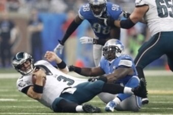 Nov 26, 2015; Detroit, MI, USA; Detroit Lions middle linebacker Stephen Tulloch (55) sacks Philadelphia Eagles quarterback Mark Sanchez (3) during the third quarter of a NFL game on Thanksgiving at Ford Field. Lions win 45-14. Mandatory Credit: Raj Mehta-
