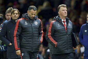 (L-R) coach Phillip Cocu of PSV, assistant trainer Ryan Giggs of Manchester United, coach Louis van Gaal of Manchester United during the UEFA Champions League group B match between Manchester United and  PSV Eindhoven on November 25, 2015 at Old Trafford 