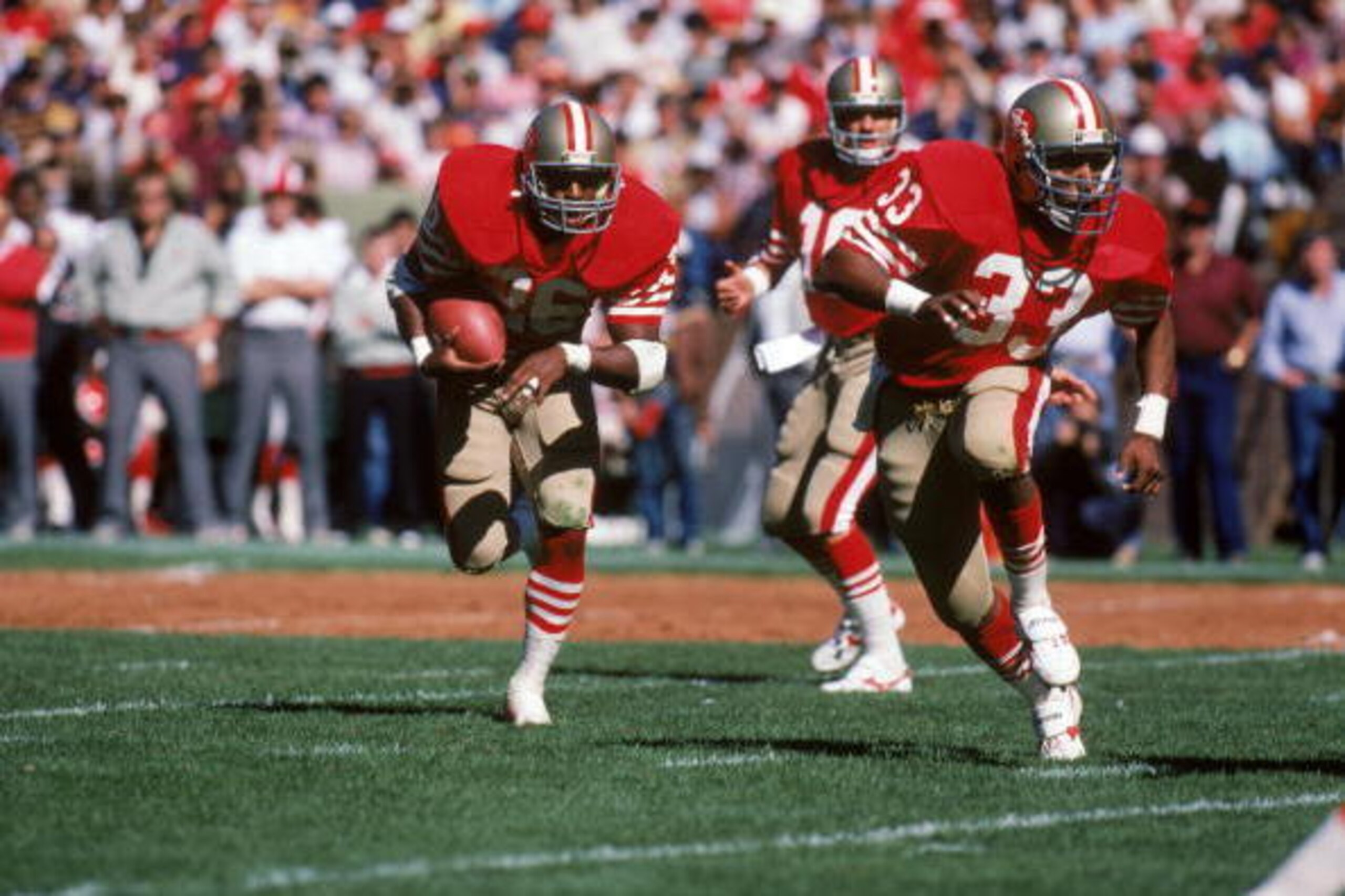 SAN FRANCISCO - SEPTEMBER 30: Running back Wendell Tyler #26 of the San Francisco 49ers runs behind the protection of teammate running back Roger Craig #33 during a game against the Atlanta Falcons at Candlestick Park on September 30, 1984 in San Francis SAN FRANCISCO - SEPTEMBER 30: Running back Wendell Tyler #26 of the San Francisco 49ers runs behind the protection of teammate running back Roger Craig #33 during a game against the Atlanta Falcons at Candlestick Park on September 30, 1984 in San Francis