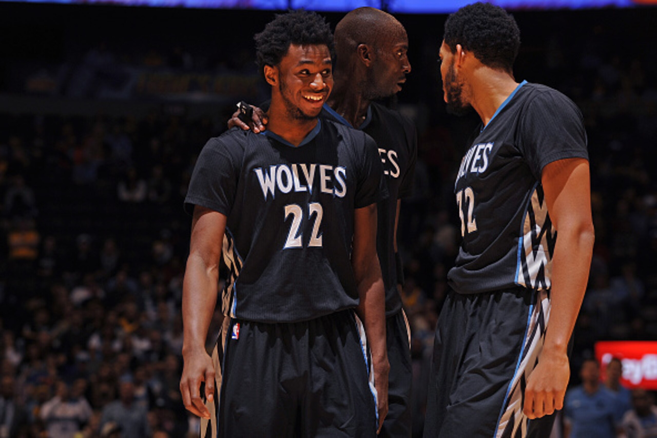 DENVER, CO - OCTOBER 30:  Andrew Wiggins #22, Kevin Garnett #21 and Karl-Anthony Towns #32 of the Minnesota Timberwolves smile and talk during the game against the Denver Nuggets on October 30, 2015 at the Pepsi Center in Denver, Colorado. NOTE TO USER: U
